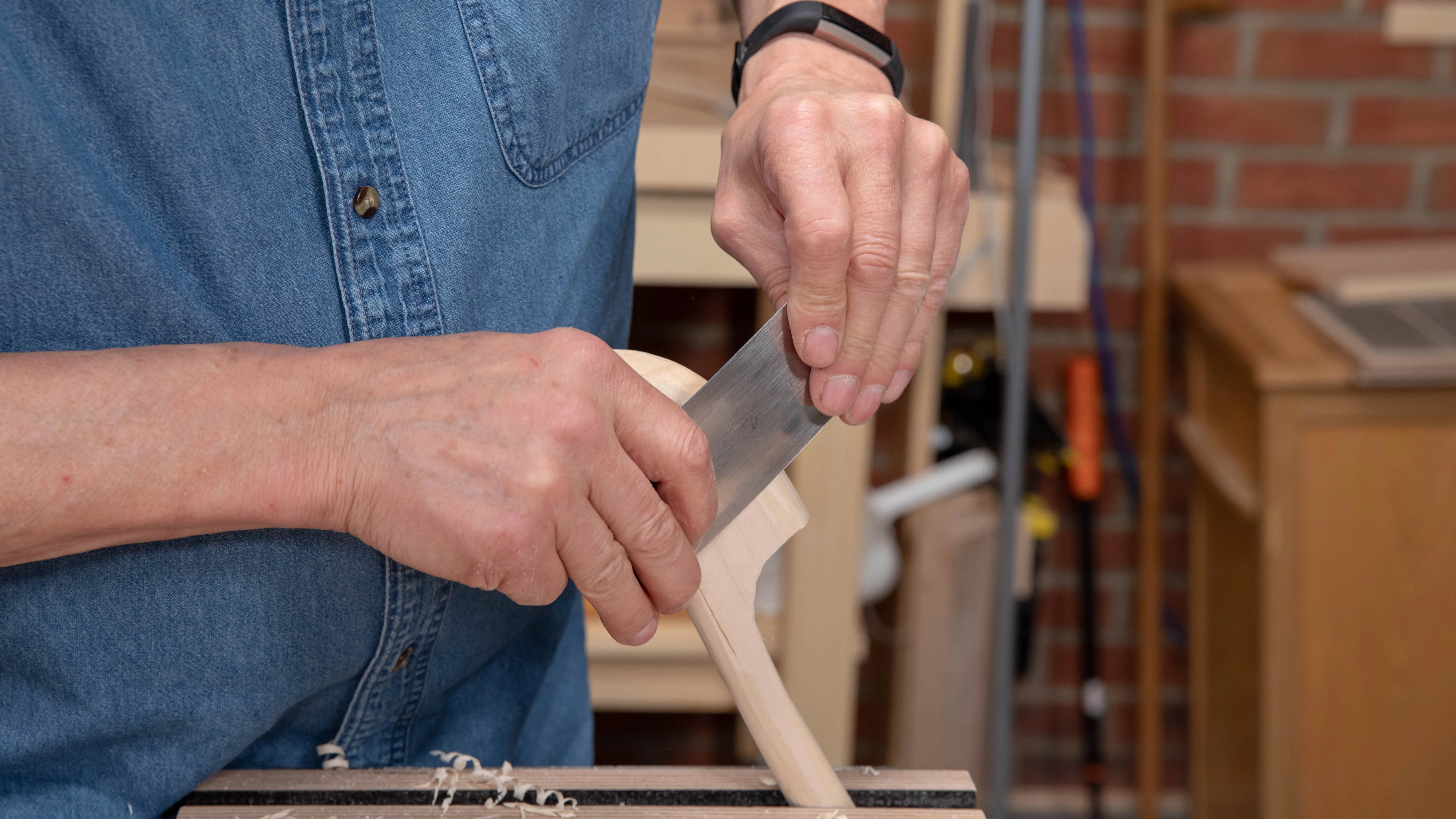 Use a card scraper to remove any ridges left by the spokeshave