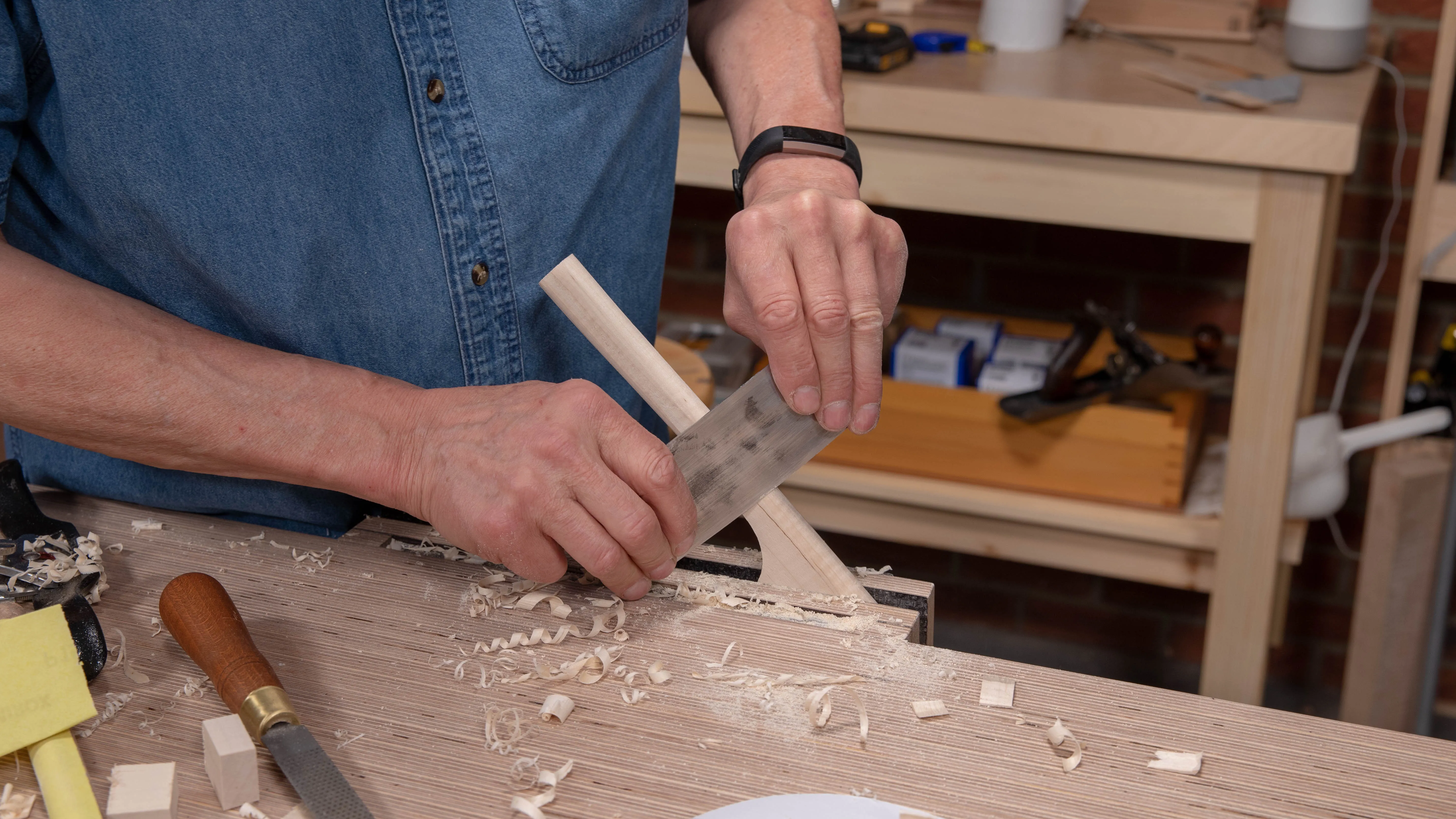 You can bend the scraper a little as you continue to refine the shape of the handle