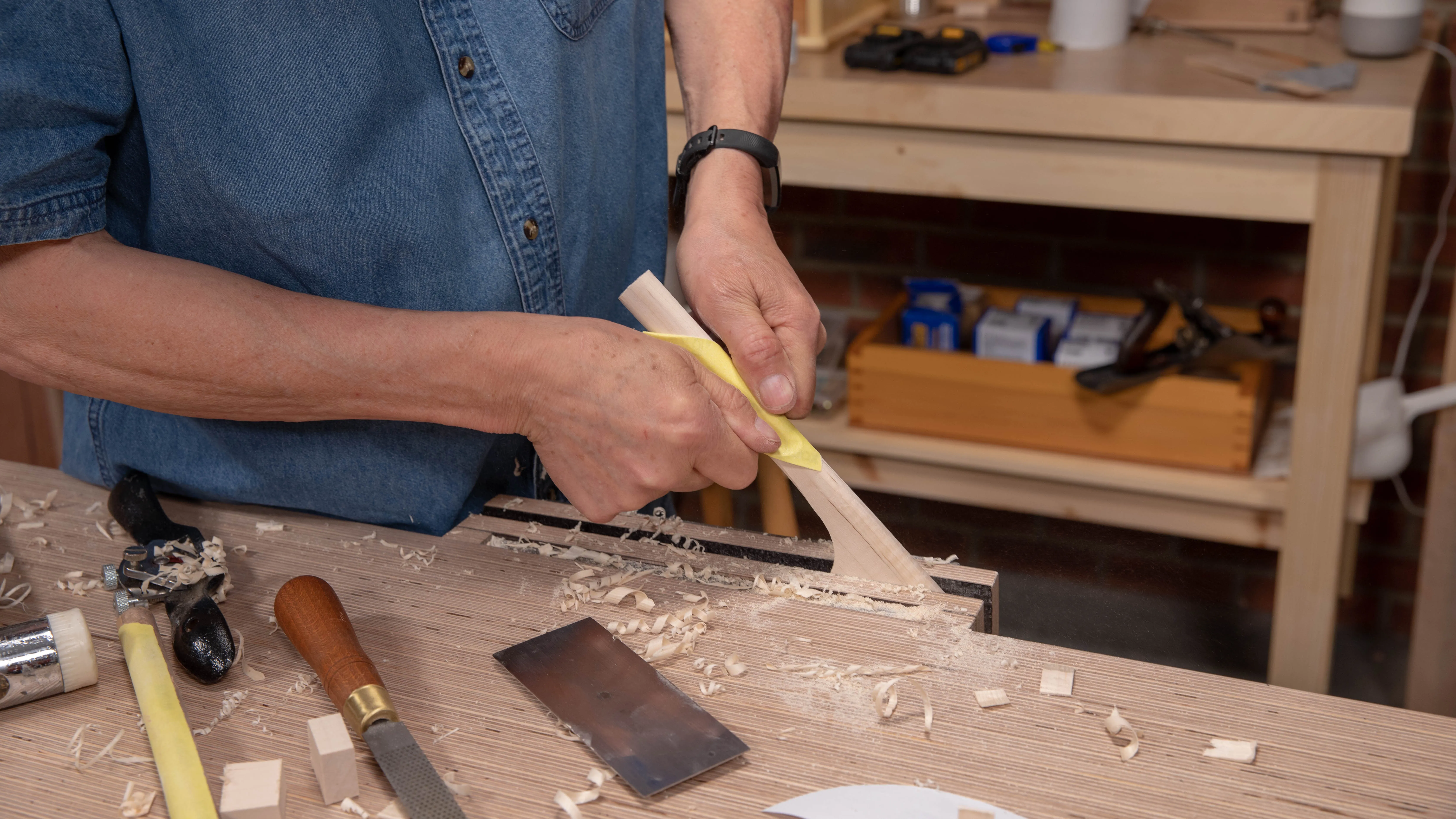 Folding the sheet of sandpaper makes it stronger and stops it from tearing