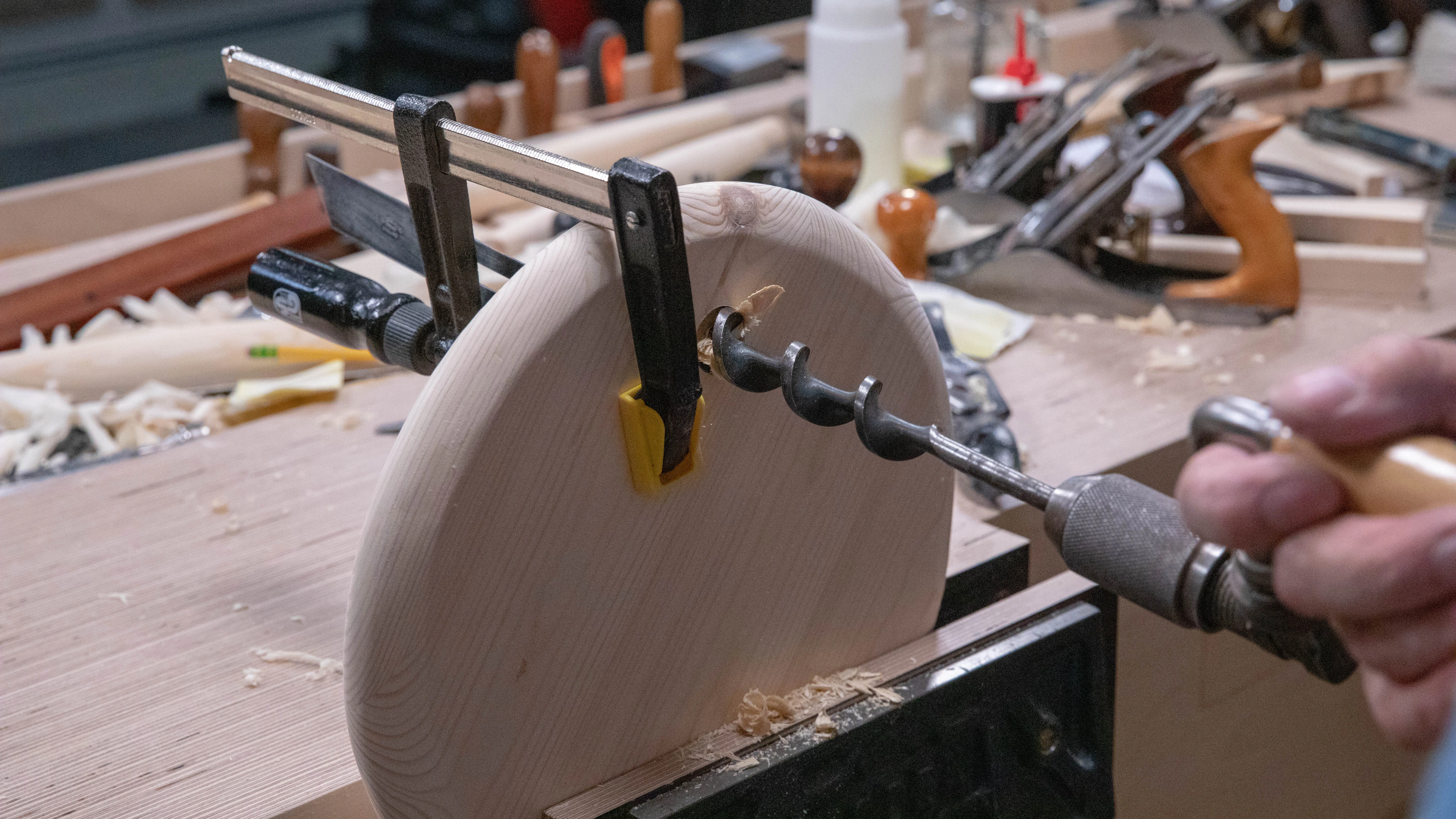 Try to estimate the right angle as you finish off the hole from the other side