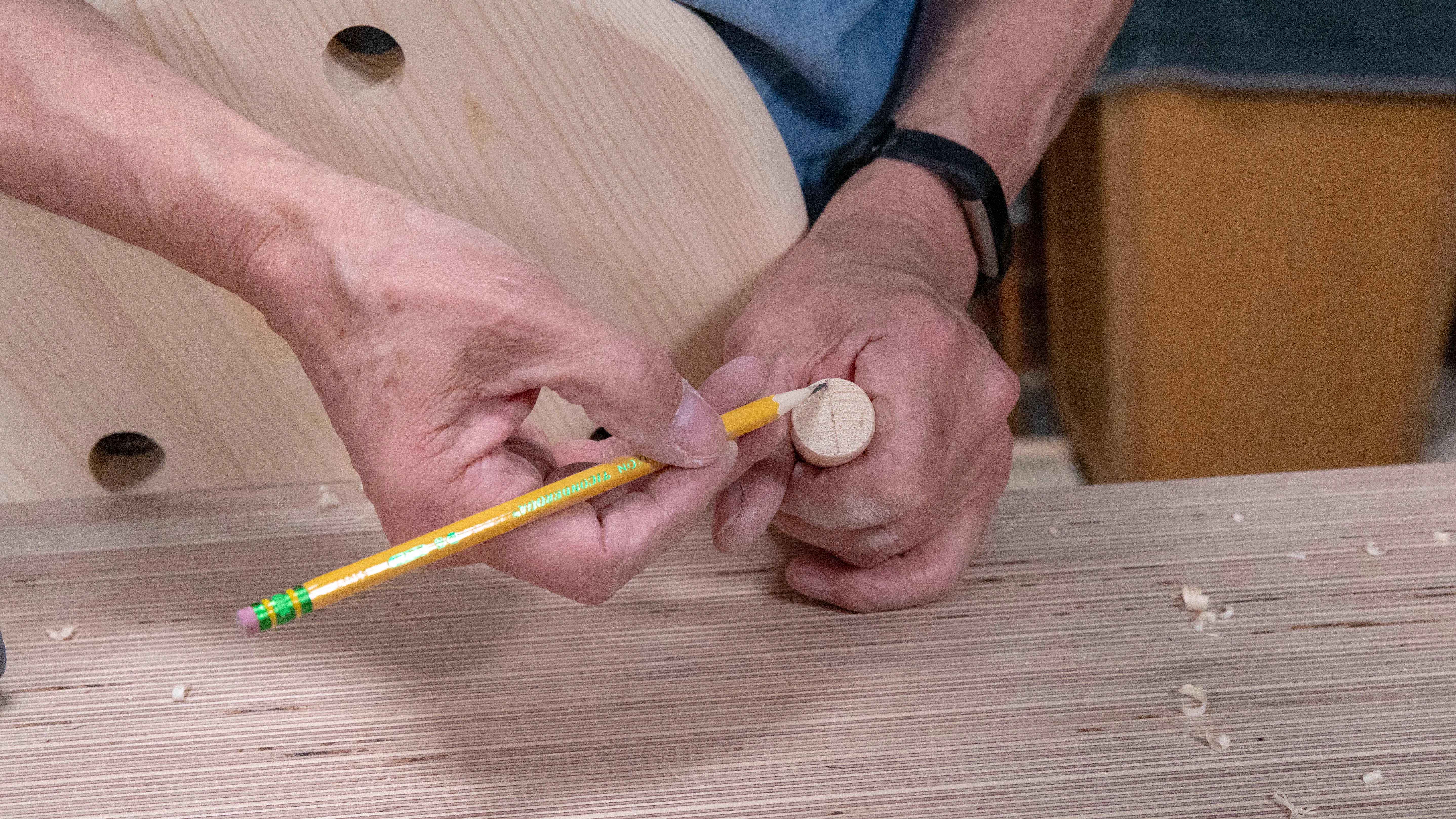 Mark a centreline on the end for the saw kerf