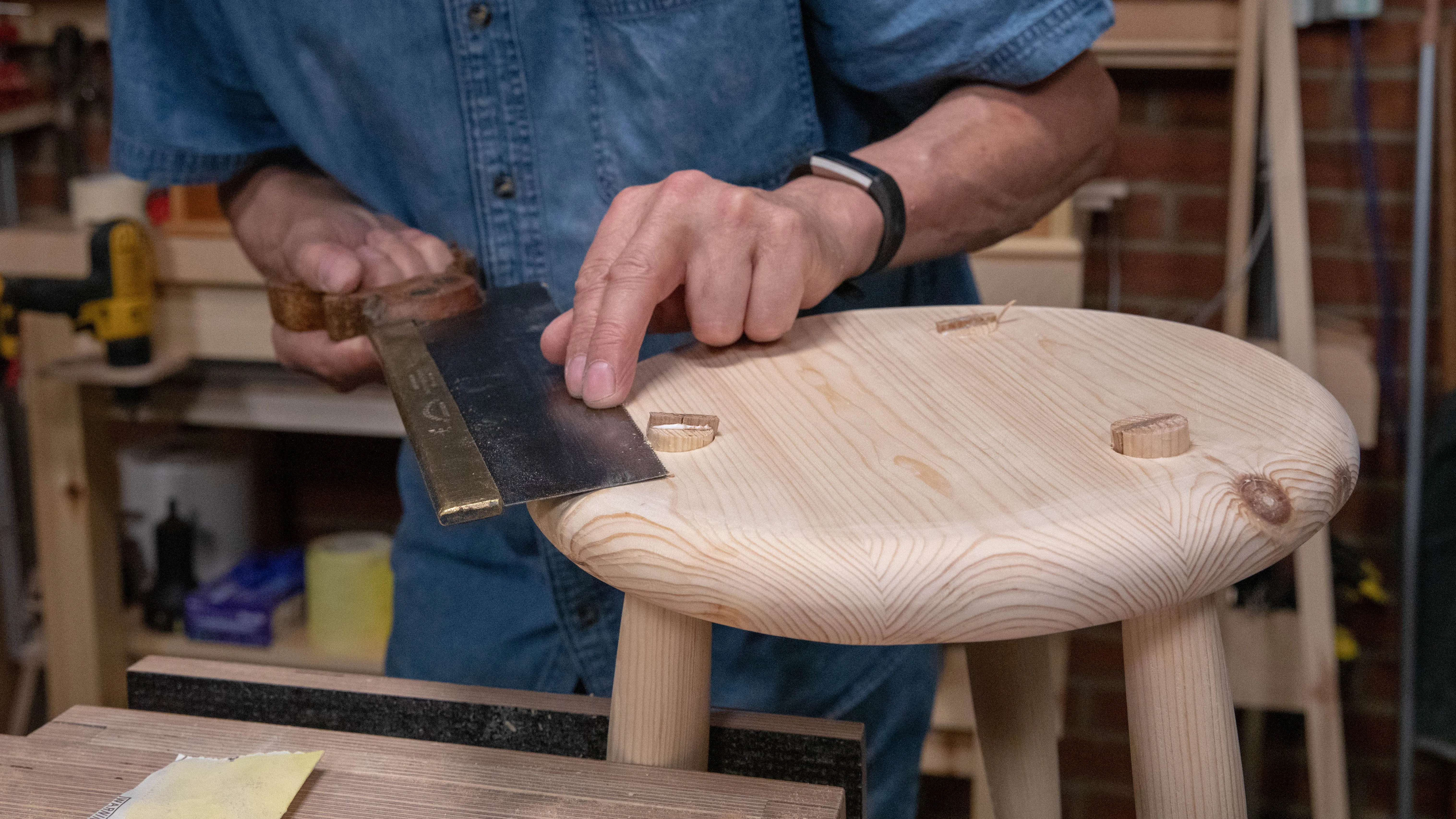 Use a tenon saw to cut off the protruding ends of the legs