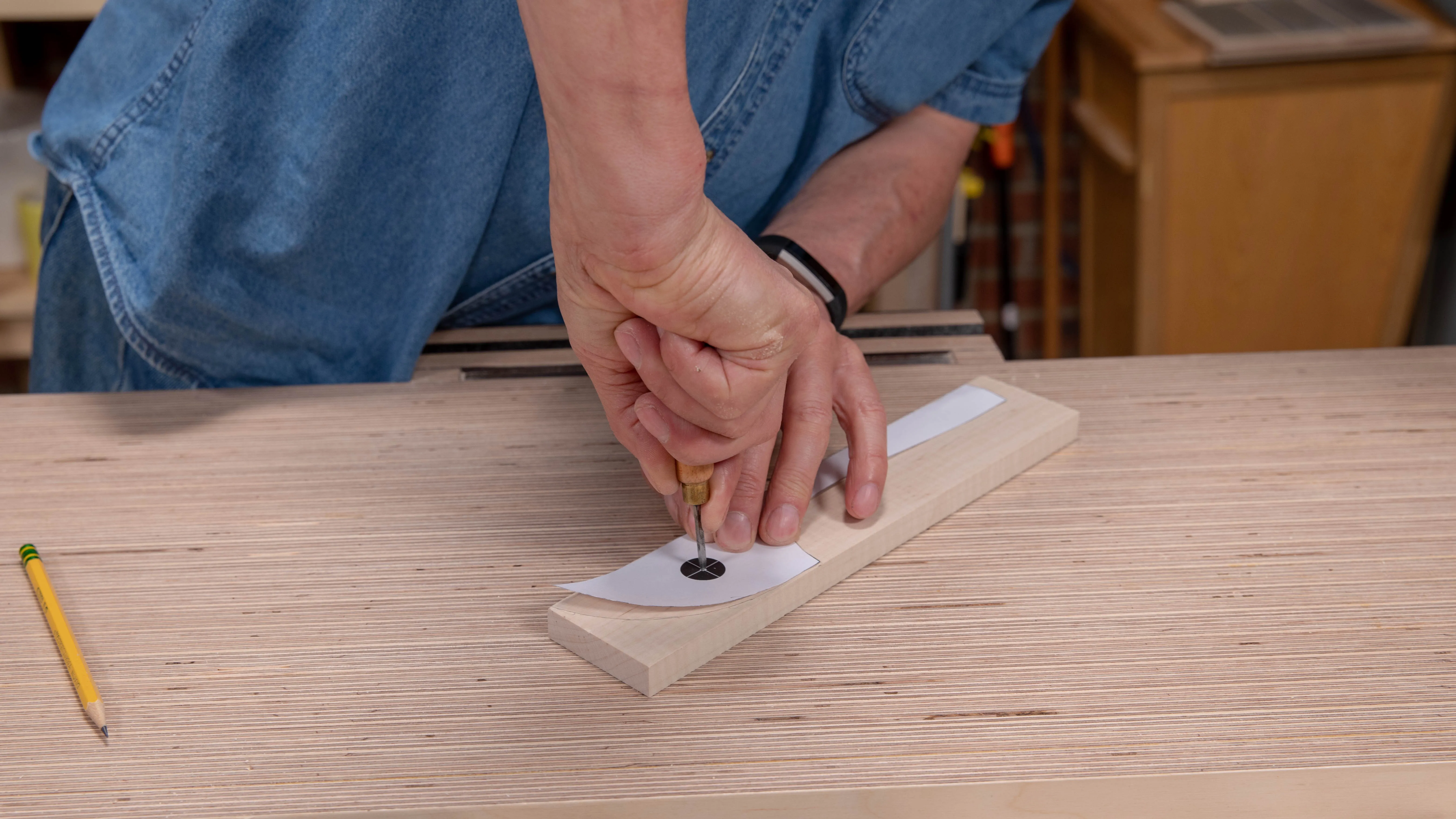 Mark the very centre of the hole through the template using a square awl