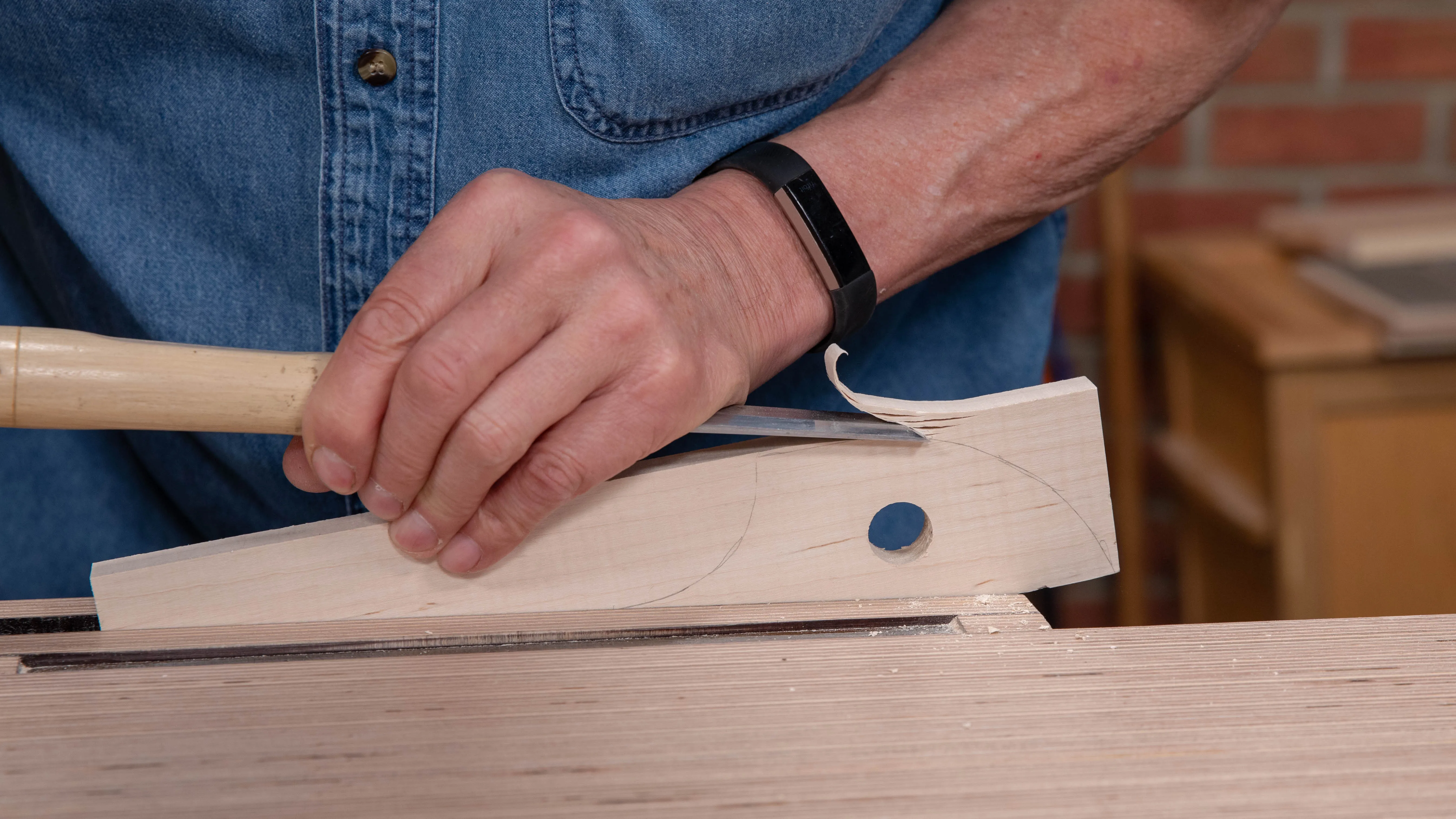 Use a 1" chisel (bevel up) and chisel hammer to chop around the curved head