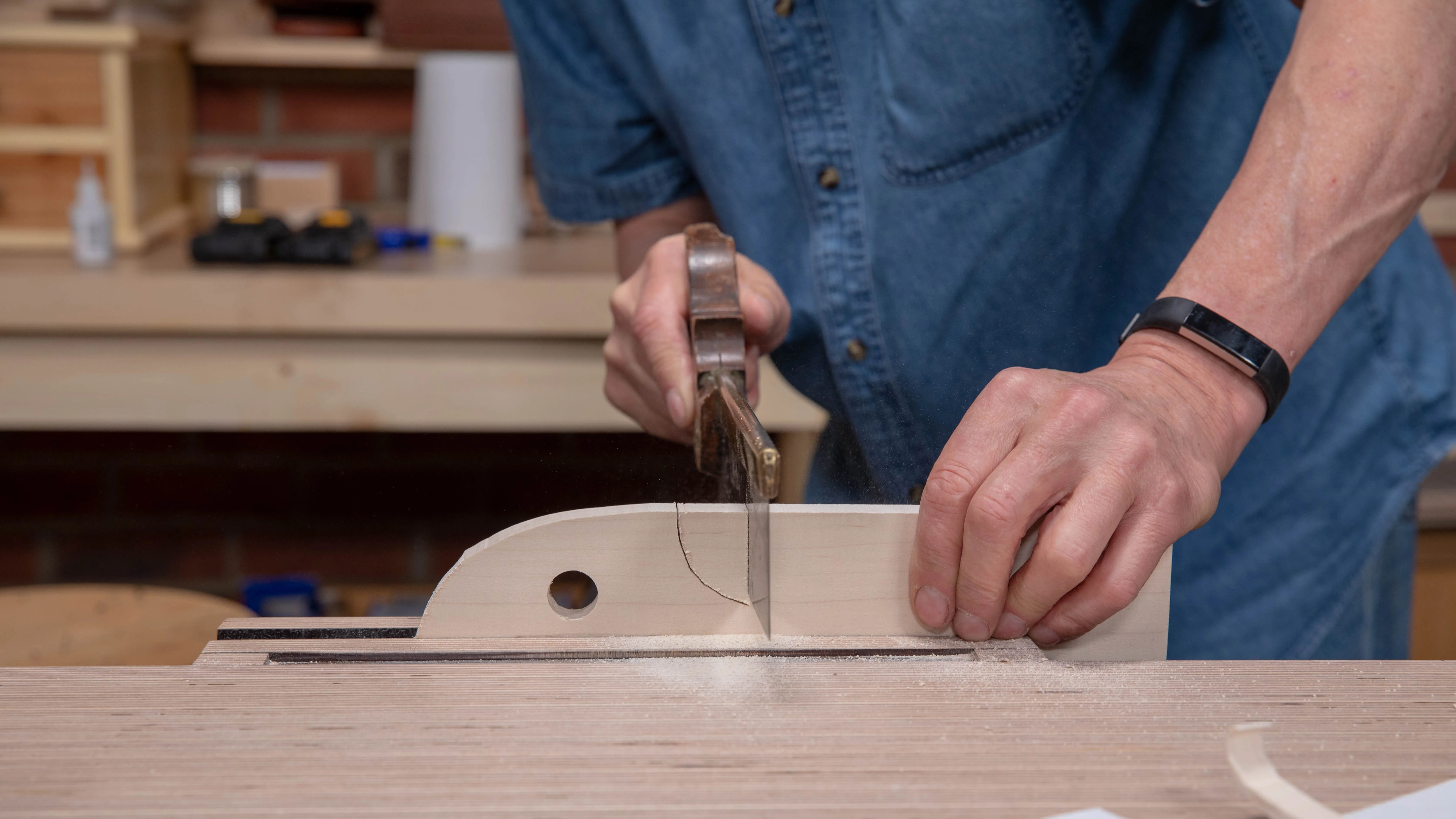 Create a series of parallel saw kerfs (stop cuts) across the grain, but stop slightly above the line