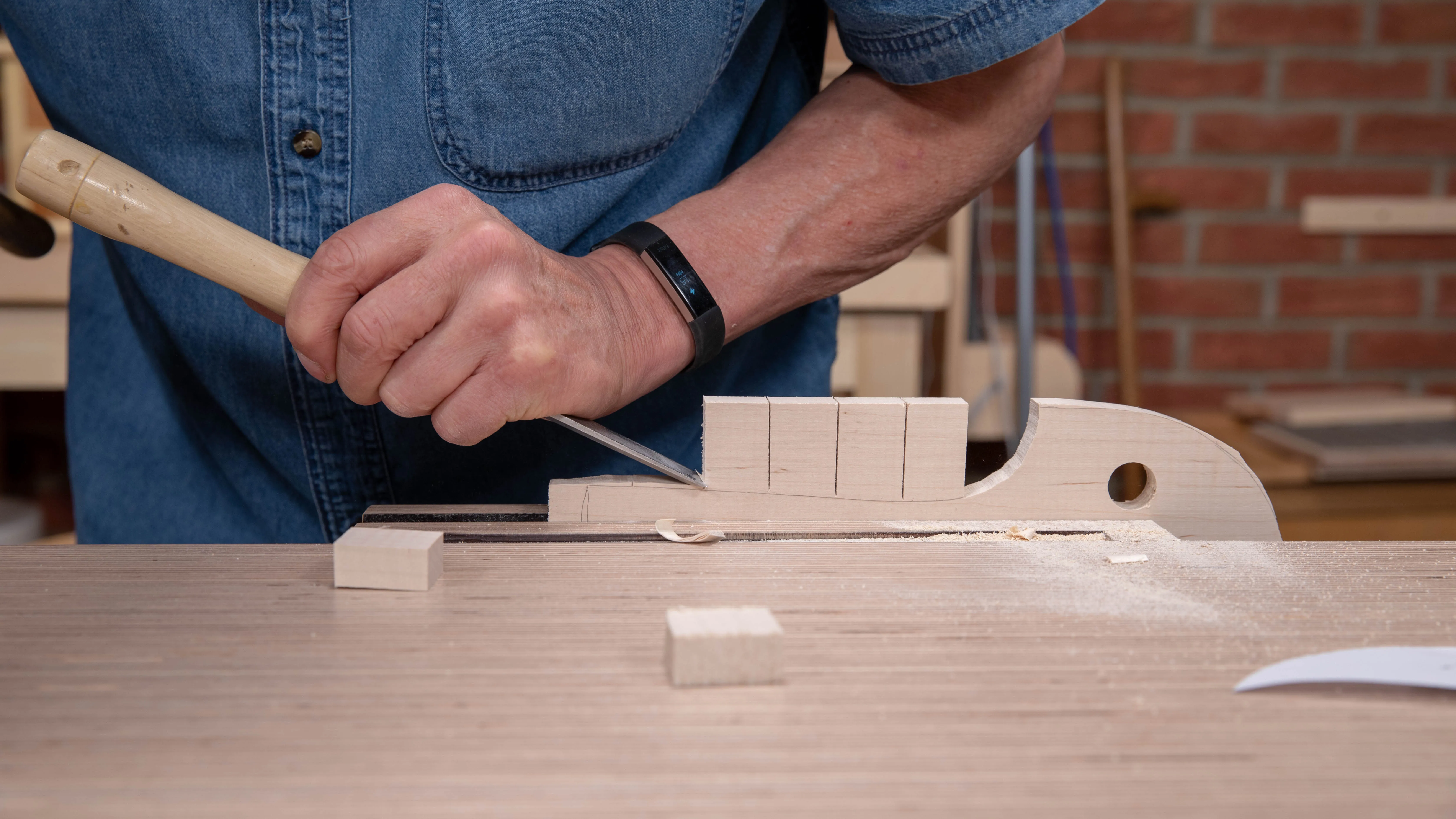Continue removing the waste and work from the other end if the wood wants to split below the line