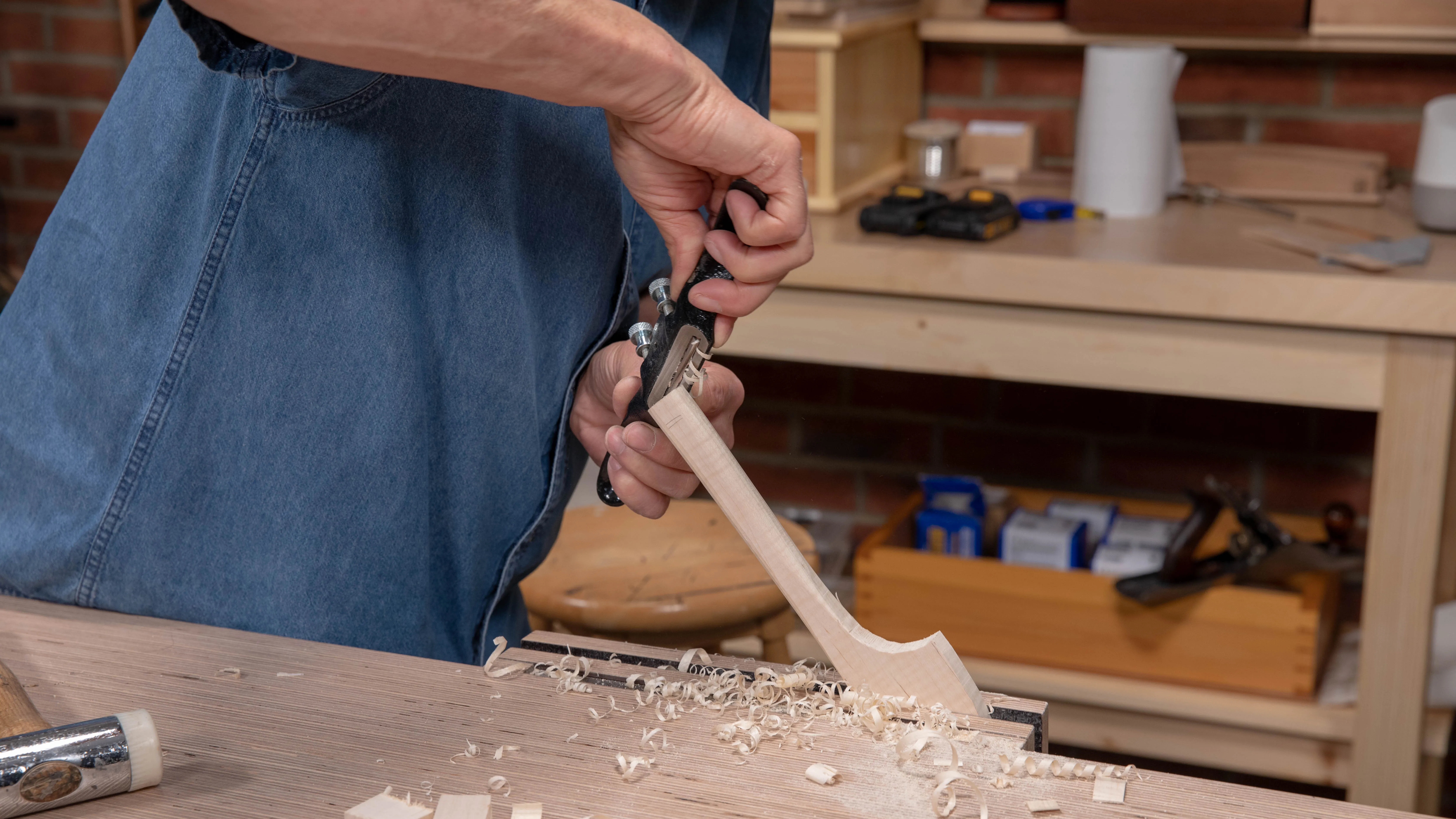 Change direction if you run into contrary grain and back the cutting iron a little on the spokeshave for a finer cut