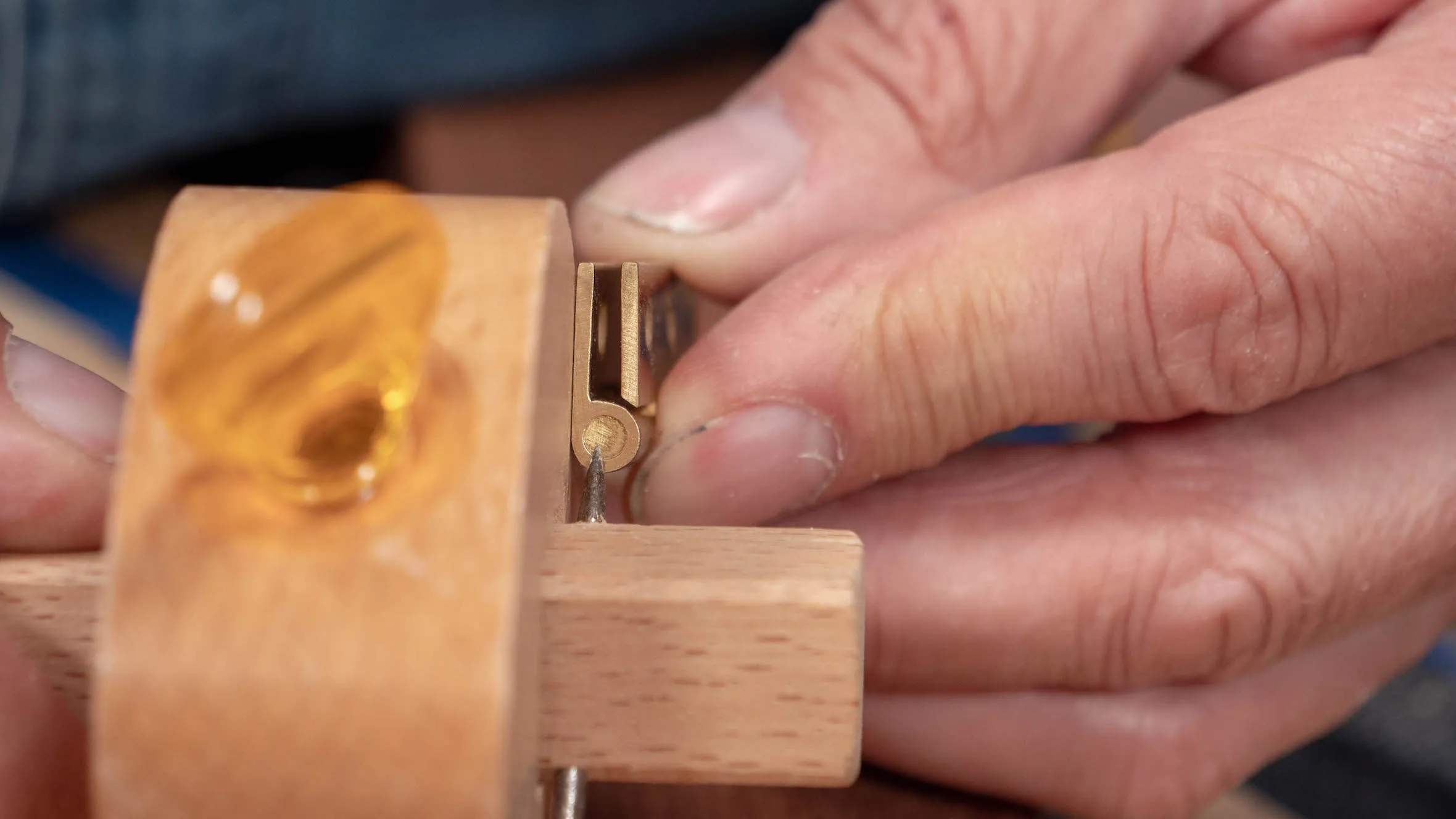 Set gauge to just under half the width of the hinge knuckle