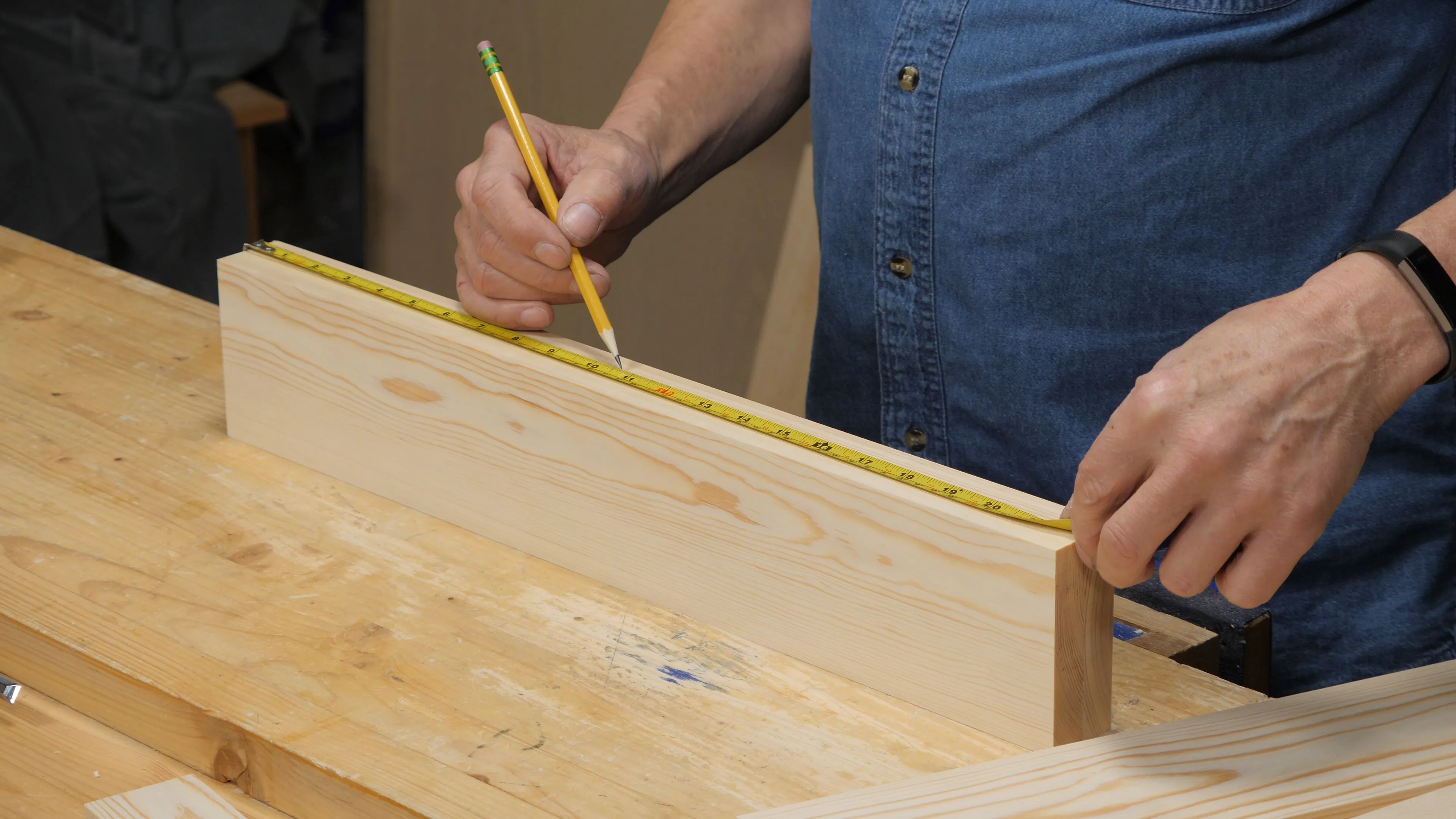 Measure the length up to the line and divide by two, marking the resulting distance from one end