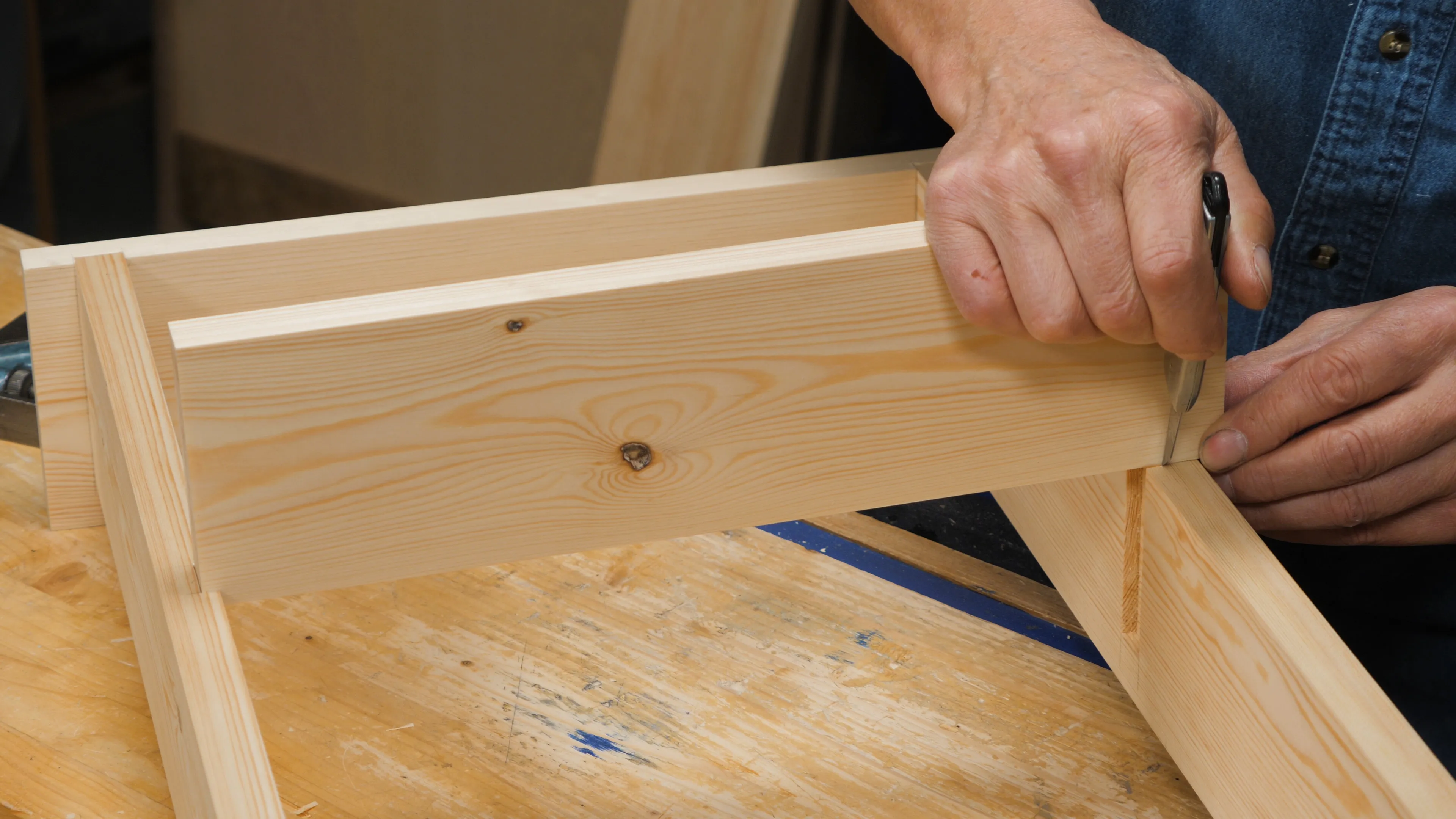 Fit one end of the shelf and mark the other with a knife nick