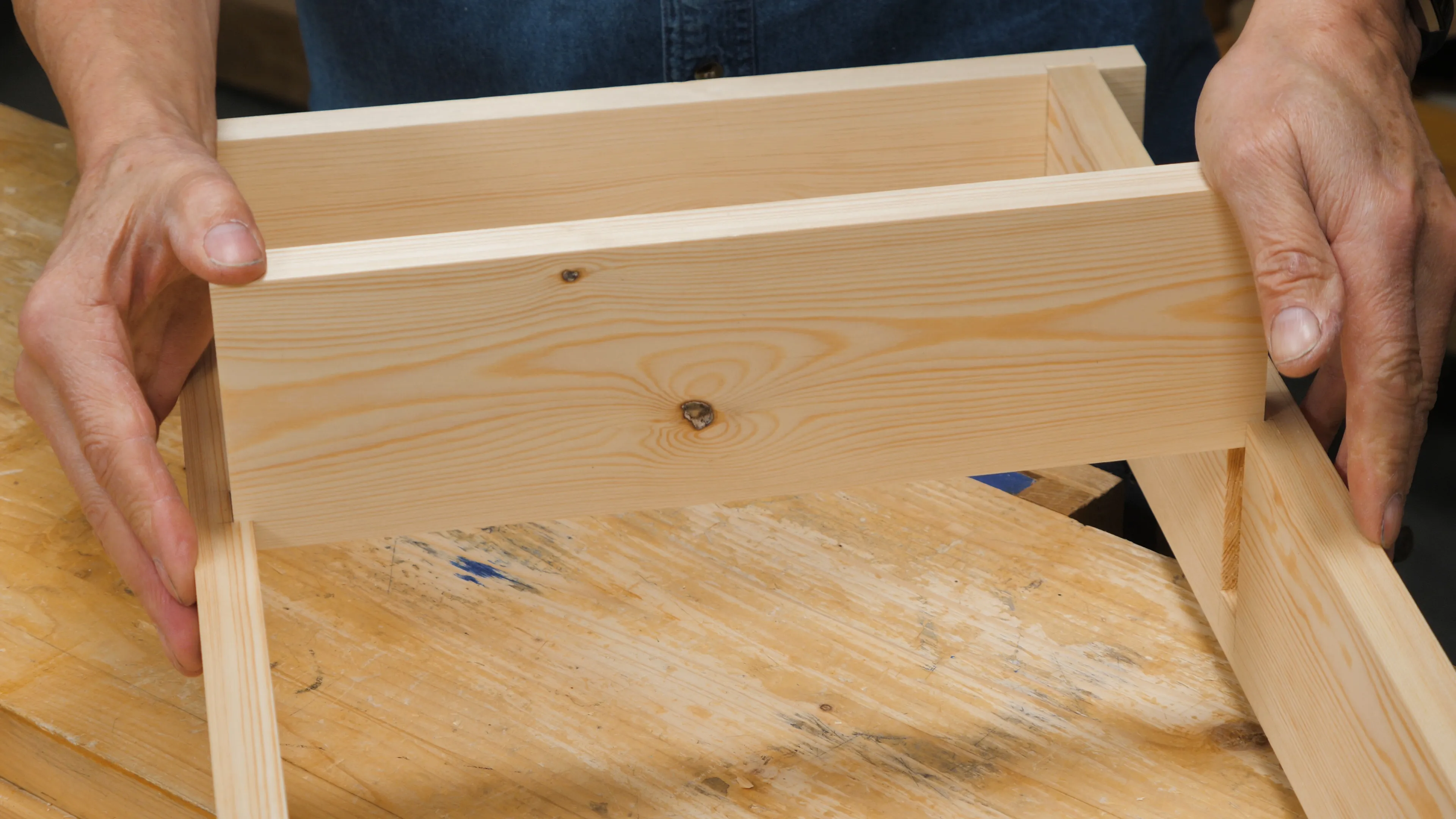 Slide the shelf piece all the way to the front