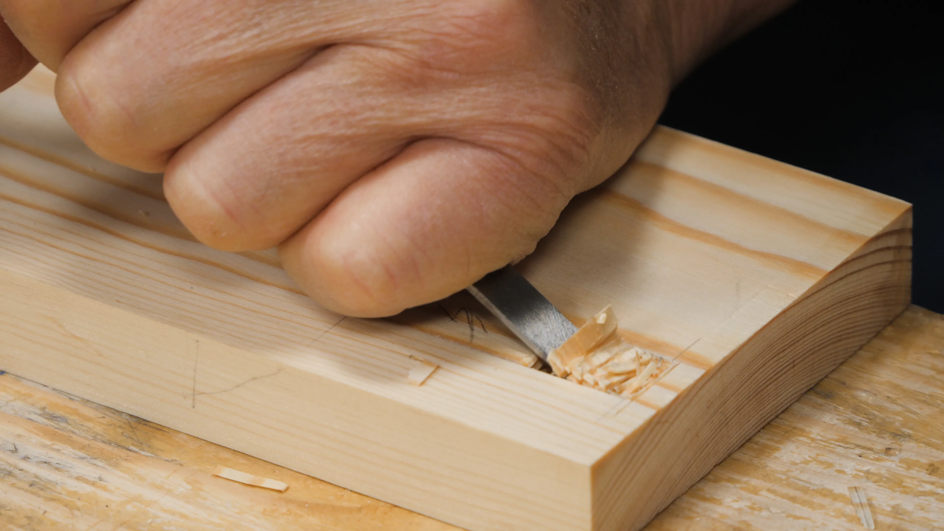 Lever out some of the waste with a narrower chisel