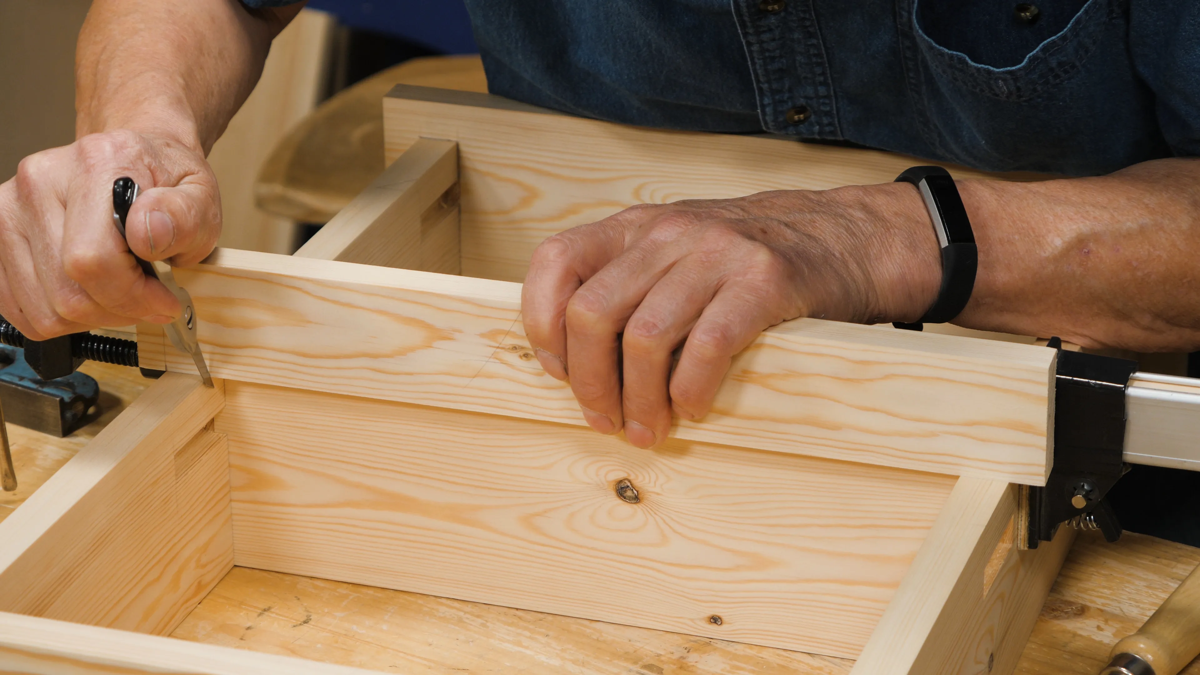 Hold the rail firmly and mark the position of the shoulder with a small knife nick