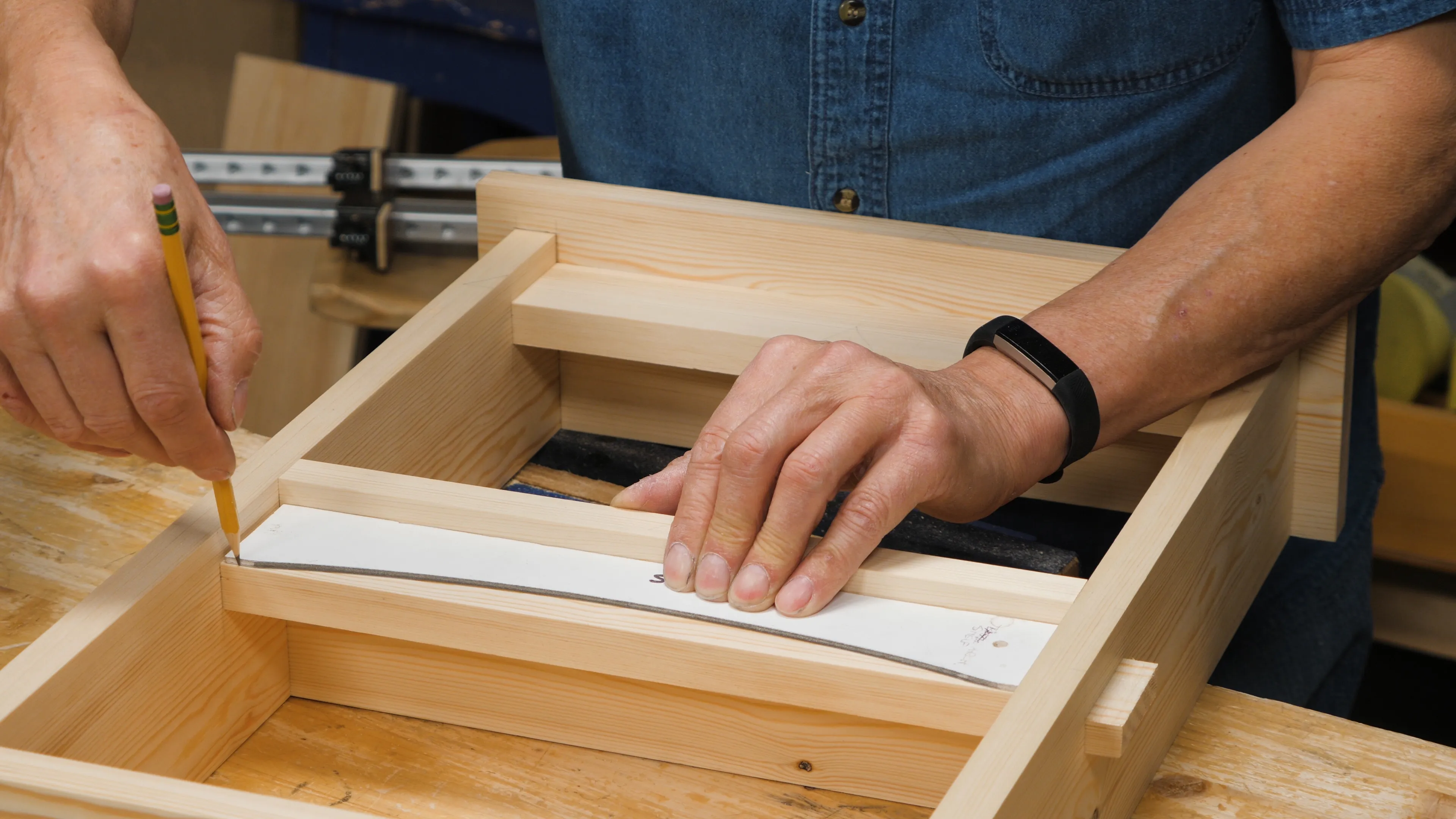 Trace around your template whilst the shelf is still together