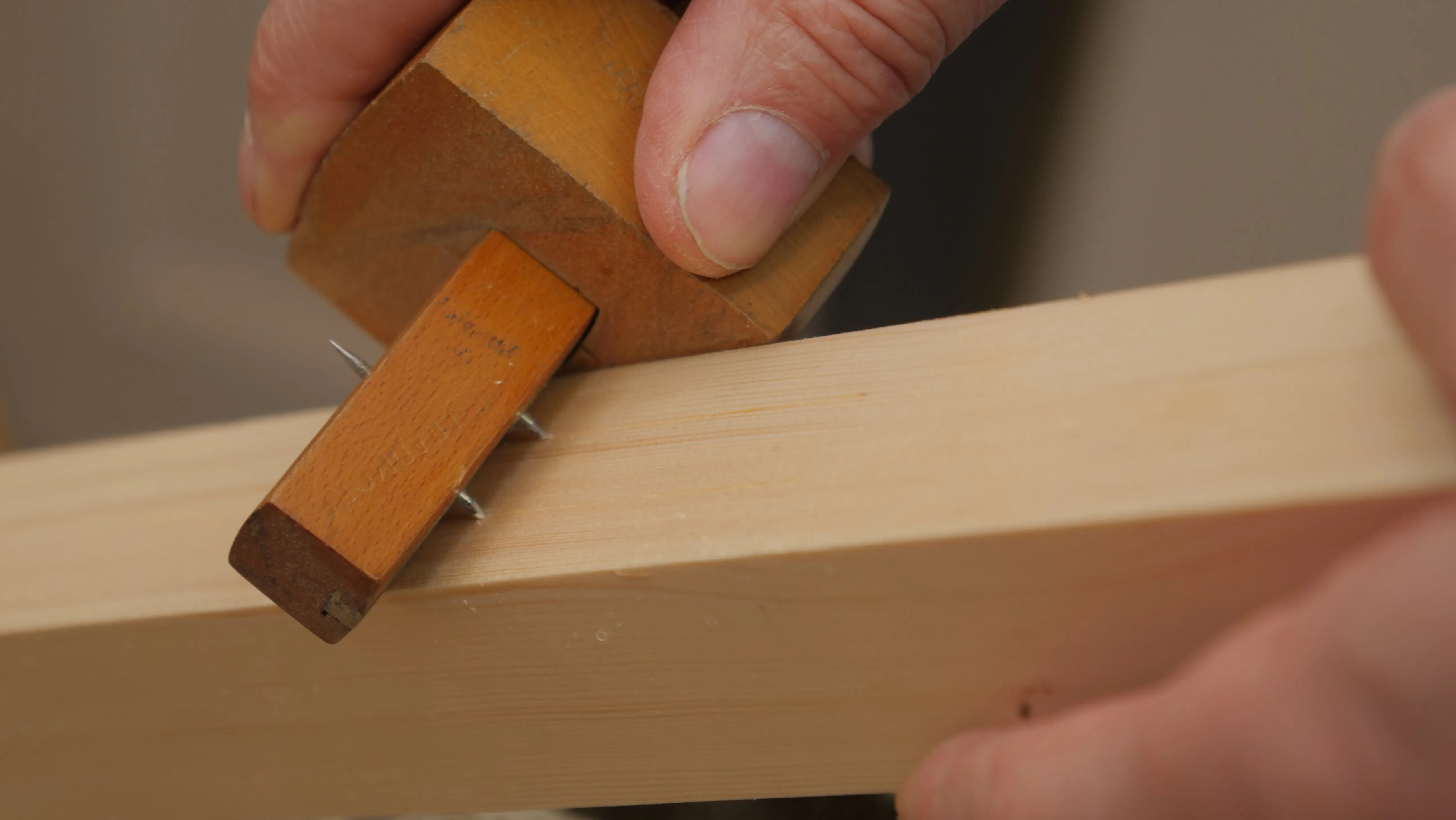 A combination gauge has two pins on one side and one pin on the other