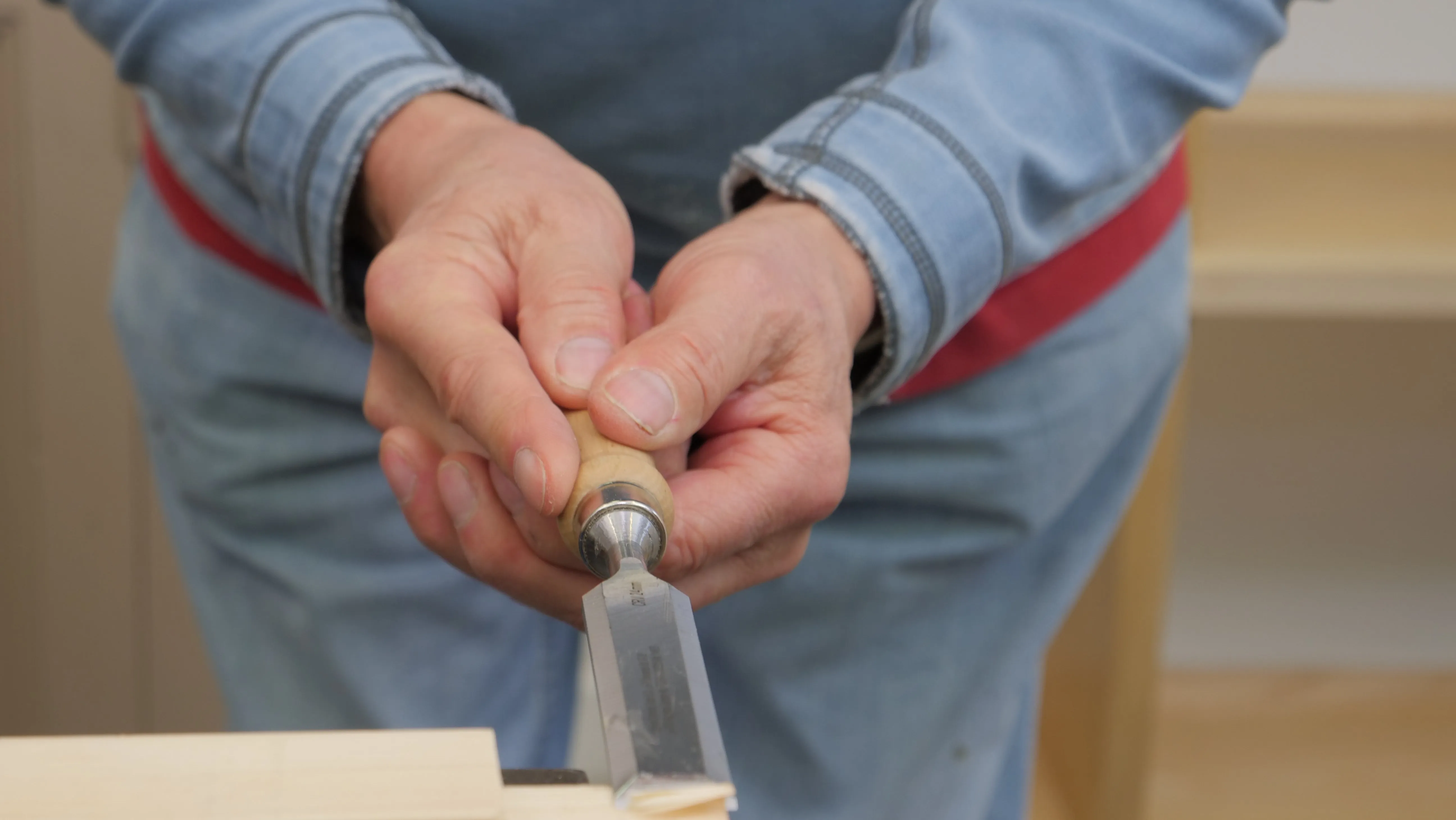 With a double handed grip as shown, we maximise the power to push the chisel forward into the wood with paring cuts