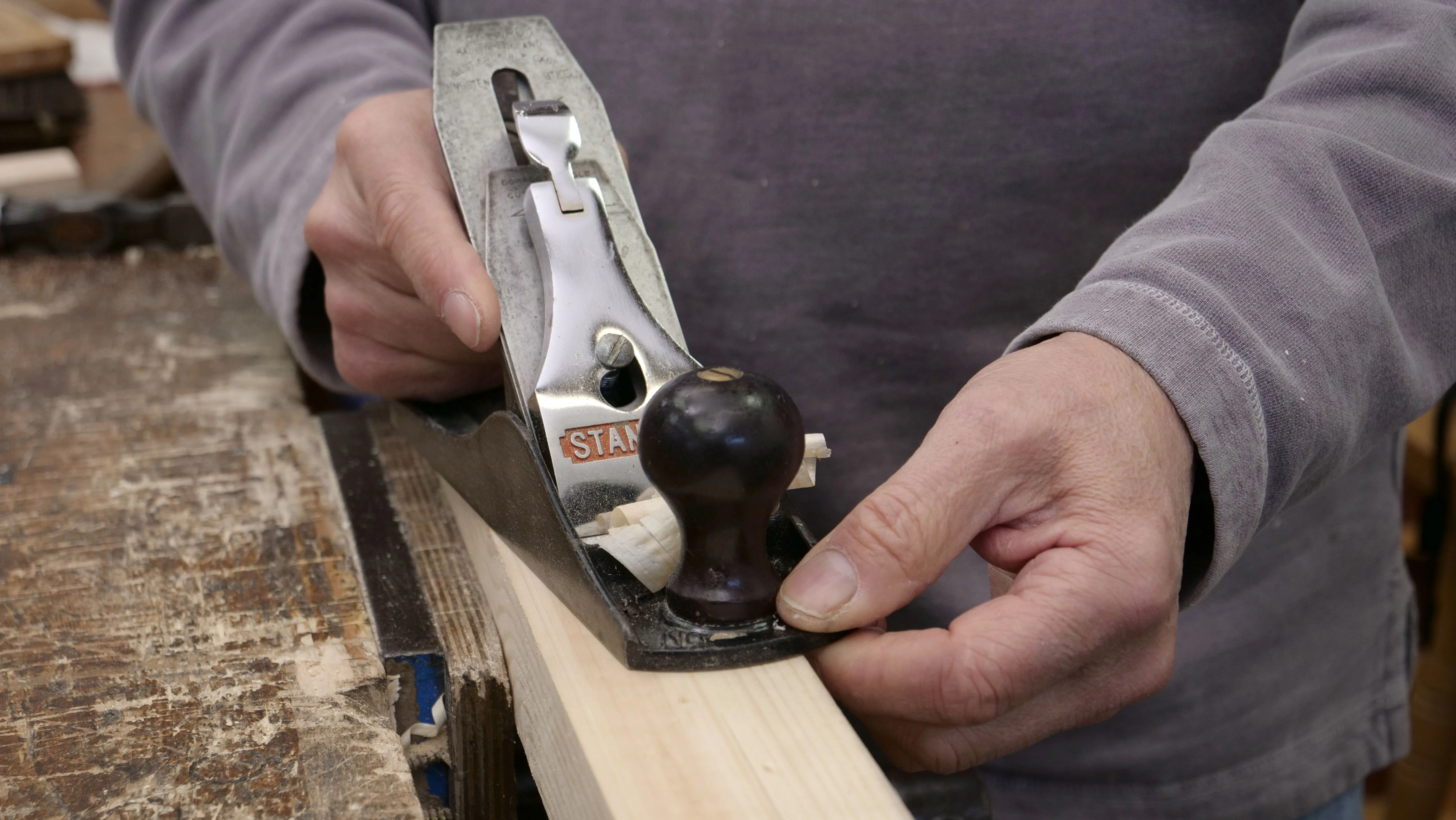 You can use your non- dominant hand as a fence to guide the plane