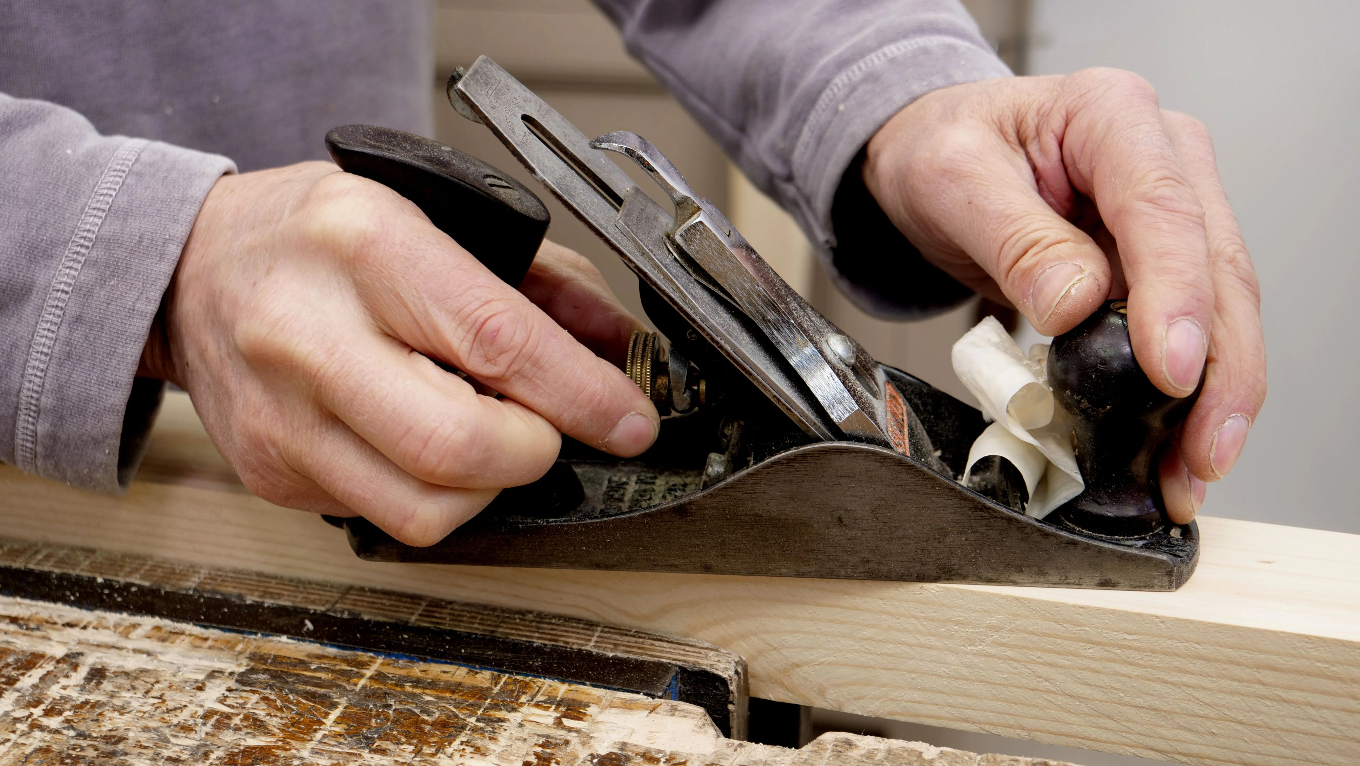 The adjustment wheel determines how deep the plane will cut. Keep turning this slightly until you get the desired depth.