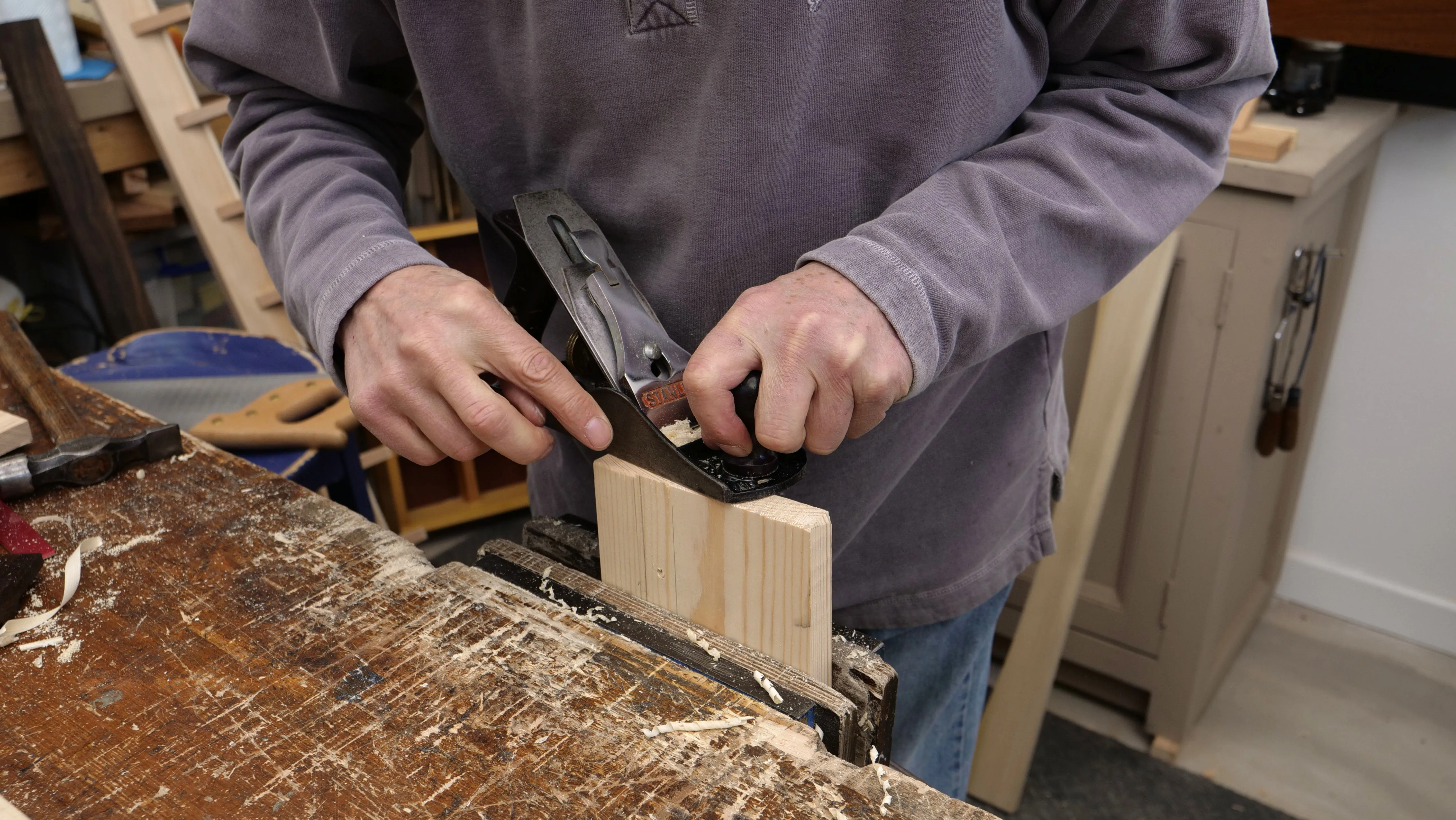 A sharp plane set to take very fine shavings can be used to plane the end of wood grain