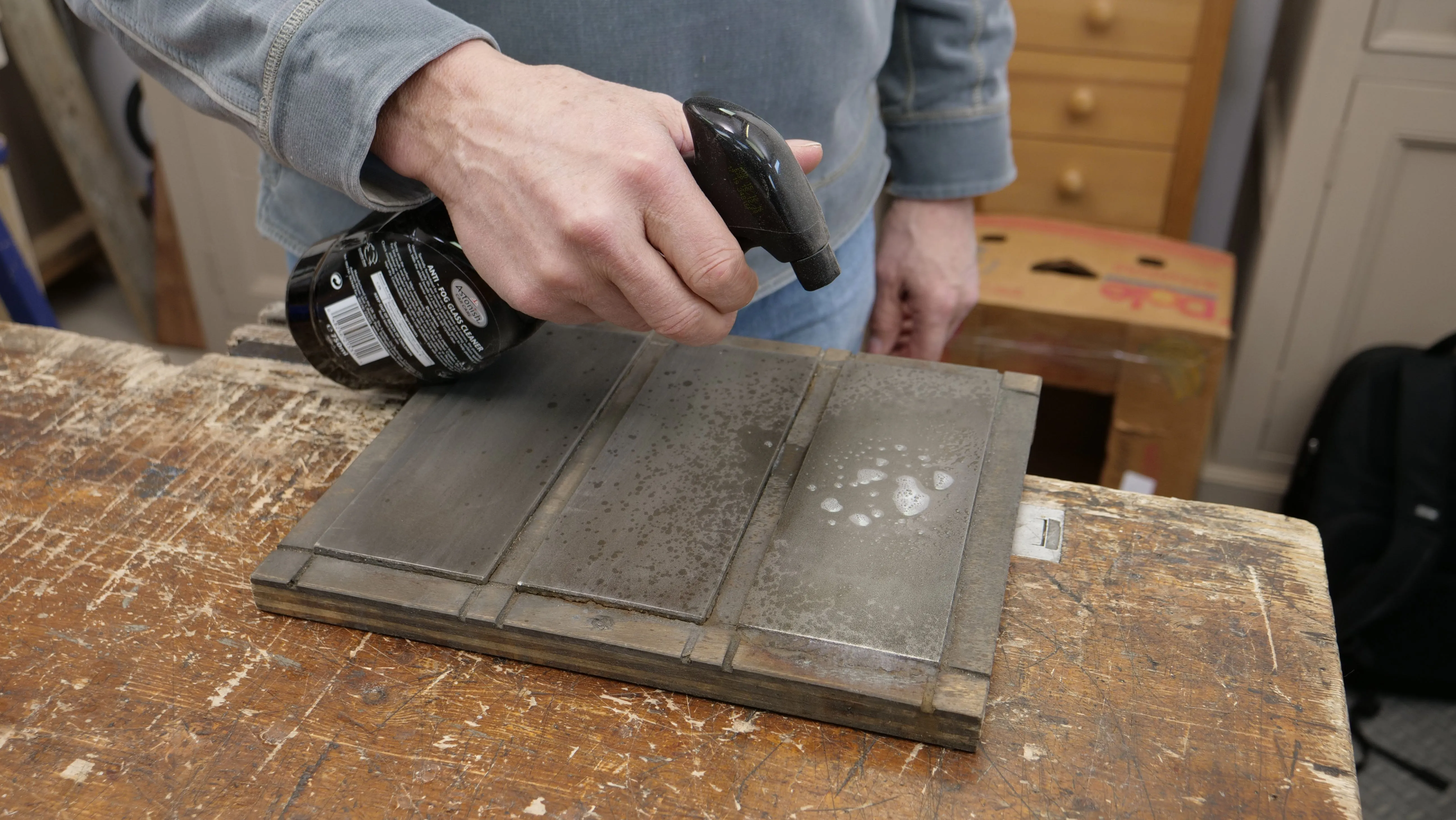 Preparing the diamond stones with auto glass cleaner for initialising/ flattening