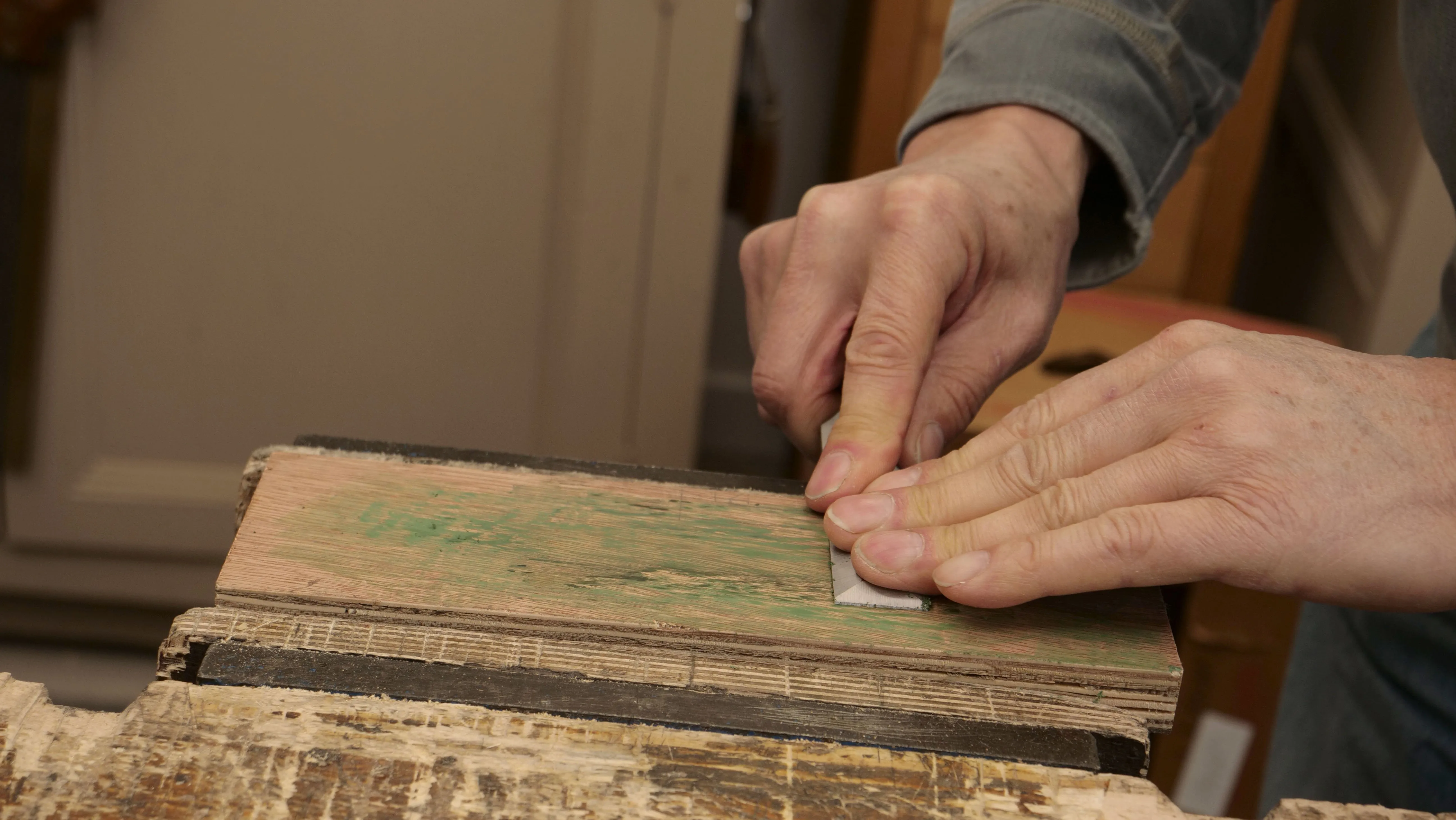 Push and pull the chisel back and forth on the strop to polish the blade