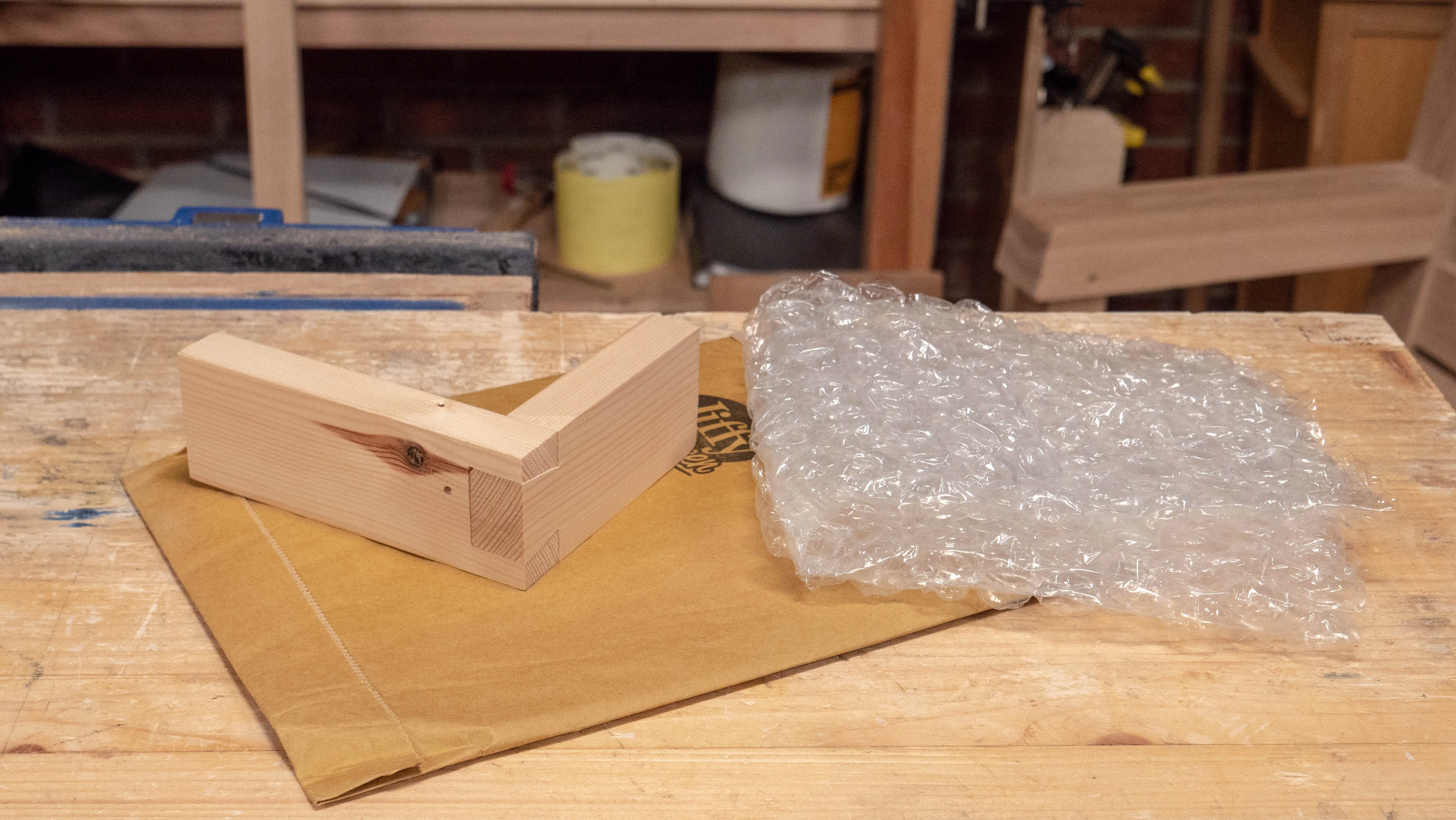 Use a padded envelope or some bubble wrap to protect your dovetail joint