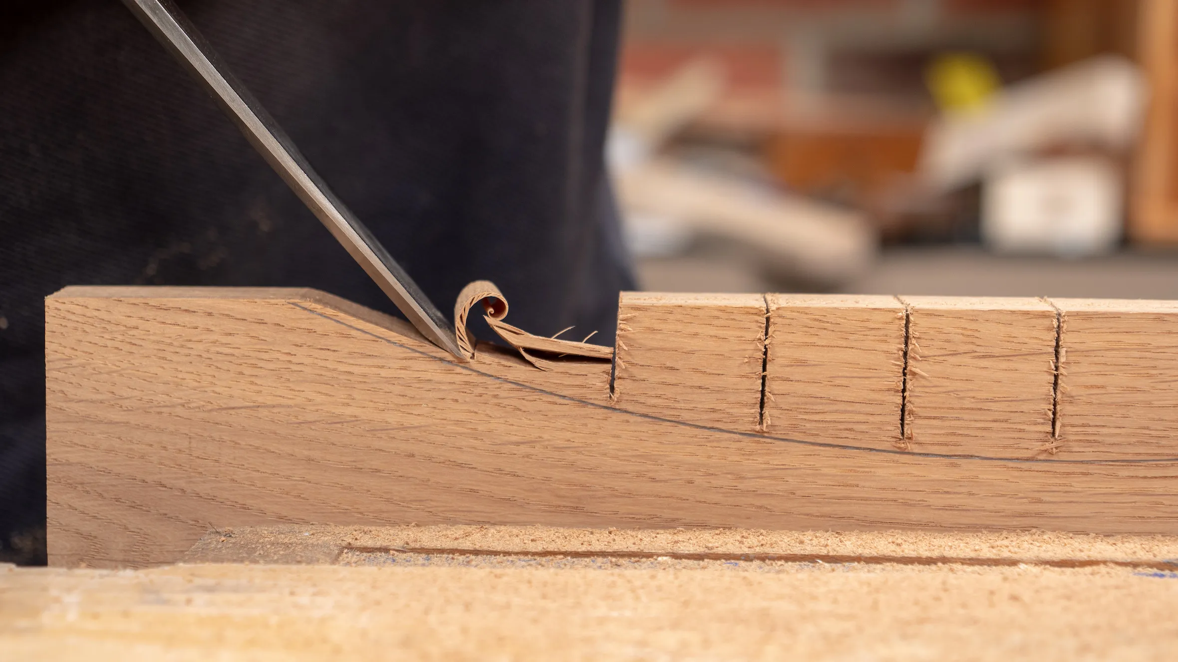 Use the chisel bevel down to make sure you don't split the grain beyond your line