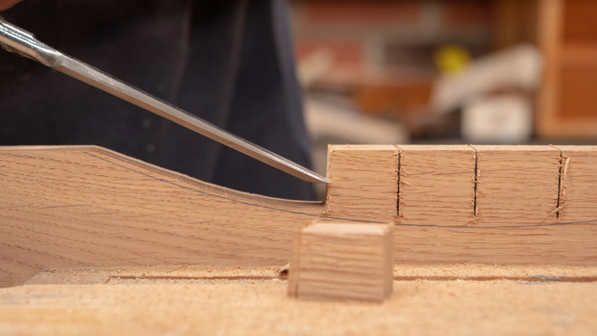 If you are unsure of the direction of grain, start your split part way up and see which direction the wood splits in