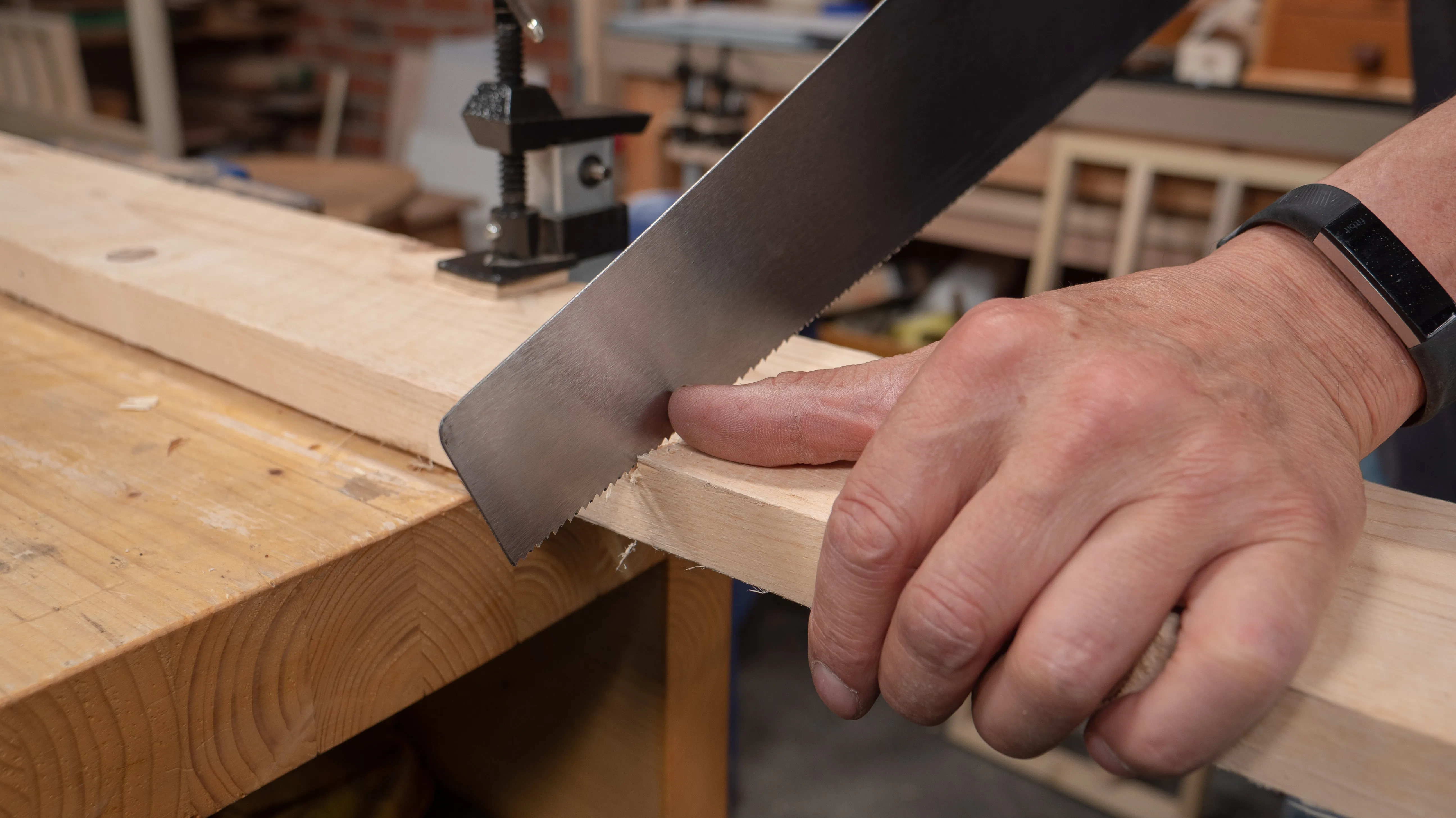 Paul uses his thumb to start the cut