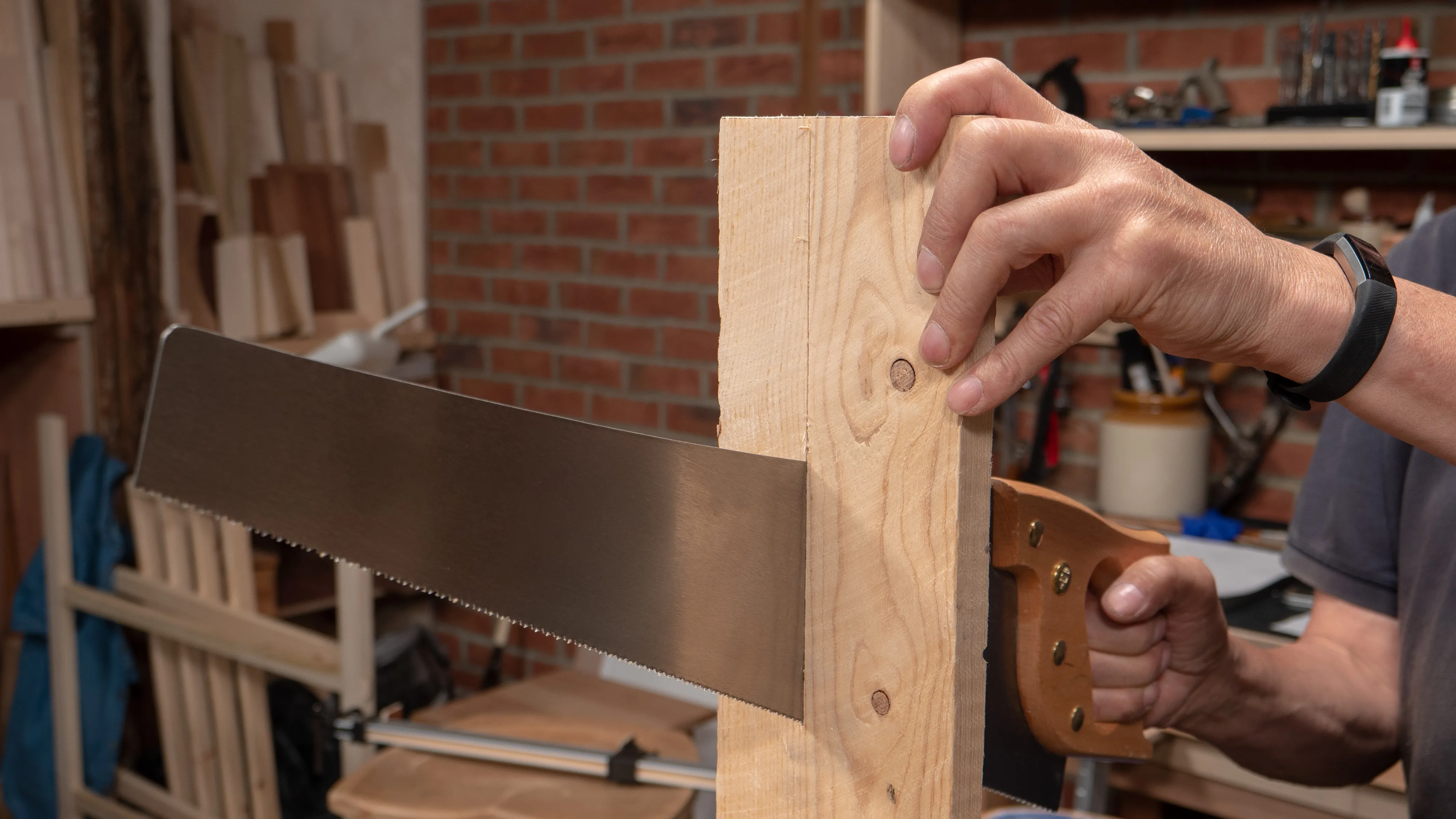 To minimise vibrations, hold the wood in your non-dominant hand while you saw, keeping your fingers away from the blade
