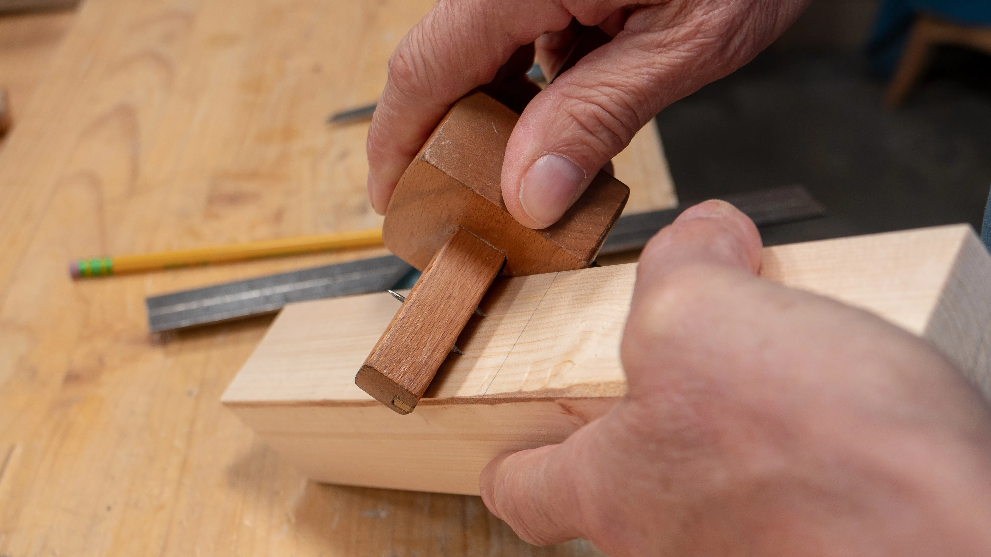 Run the pins of your mortise gauge between the pencil lines