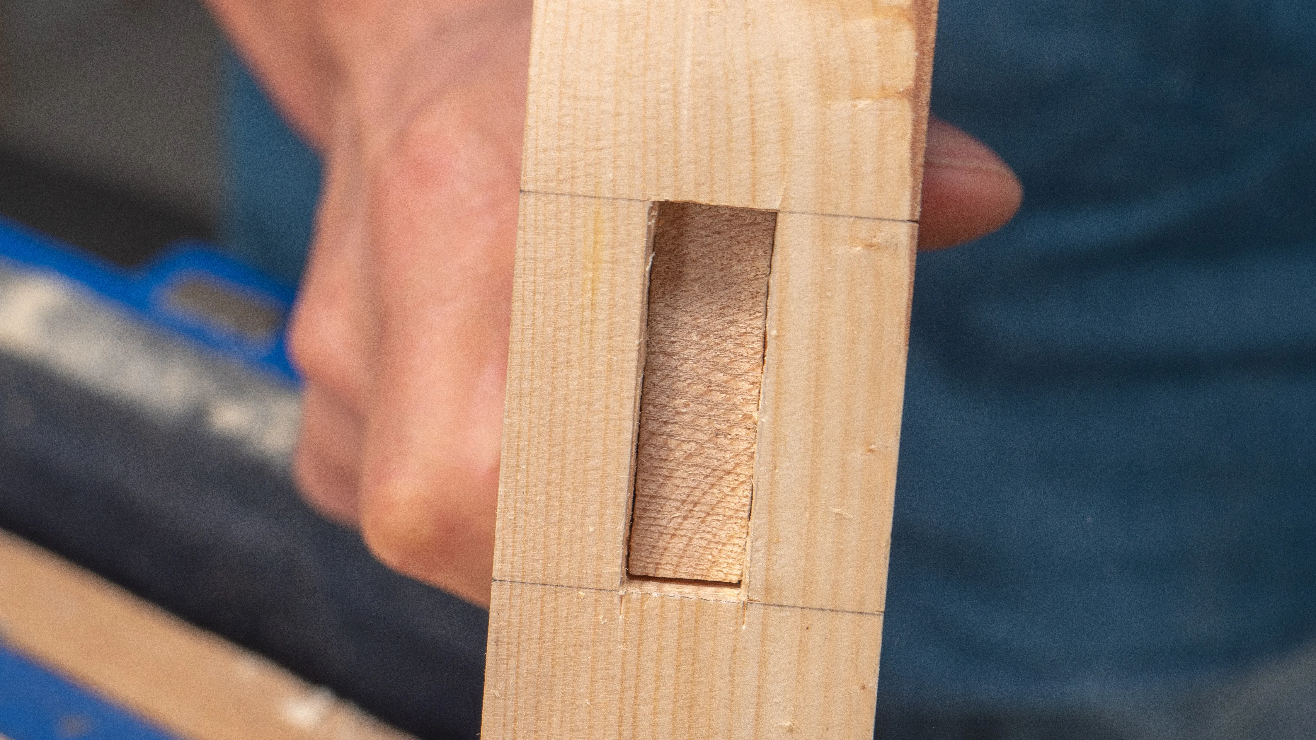 Look from the other end to check that nothing is in the way as the tenon advances in the mortise