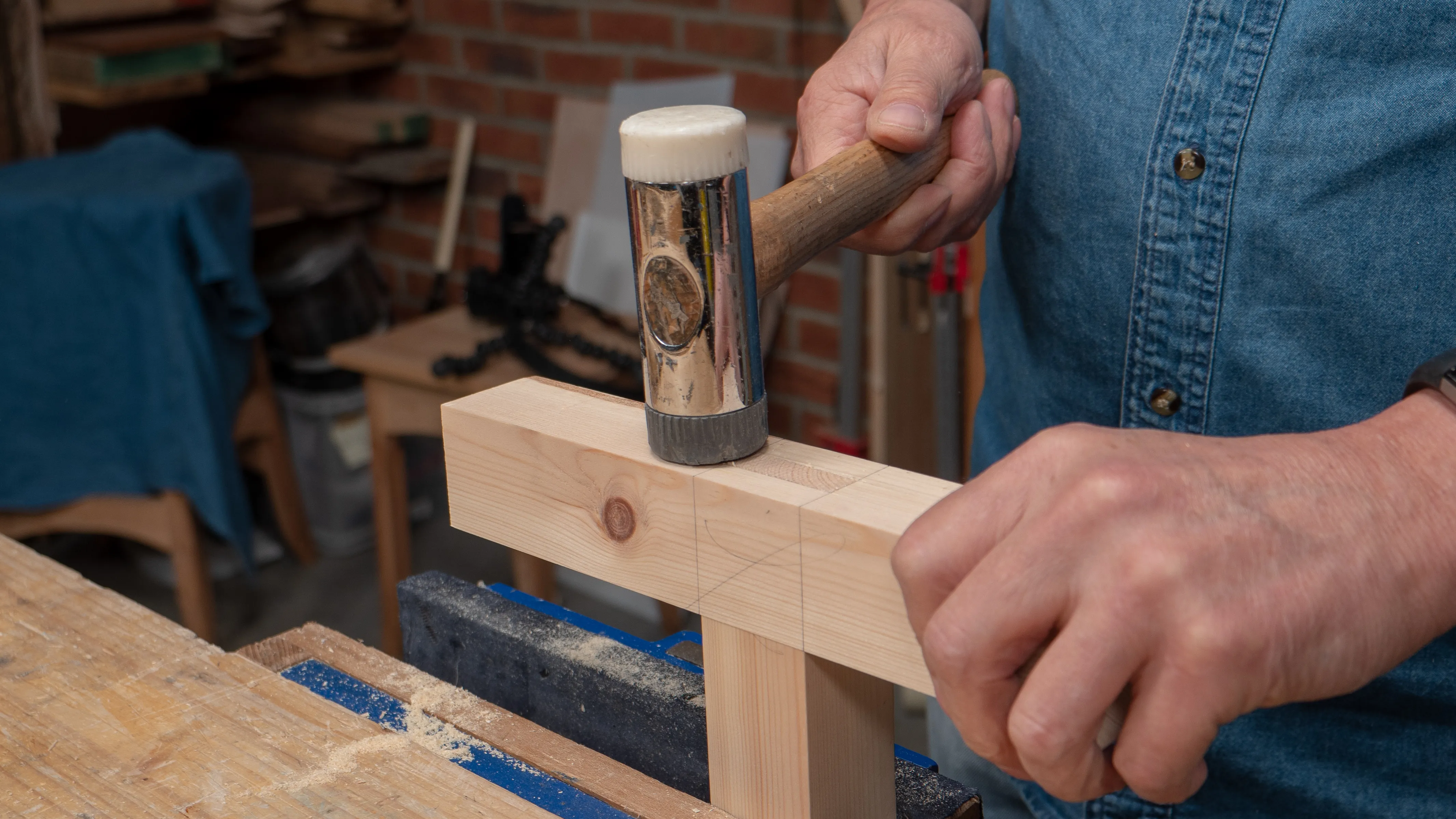 Use the rubber side of the chisel hammer