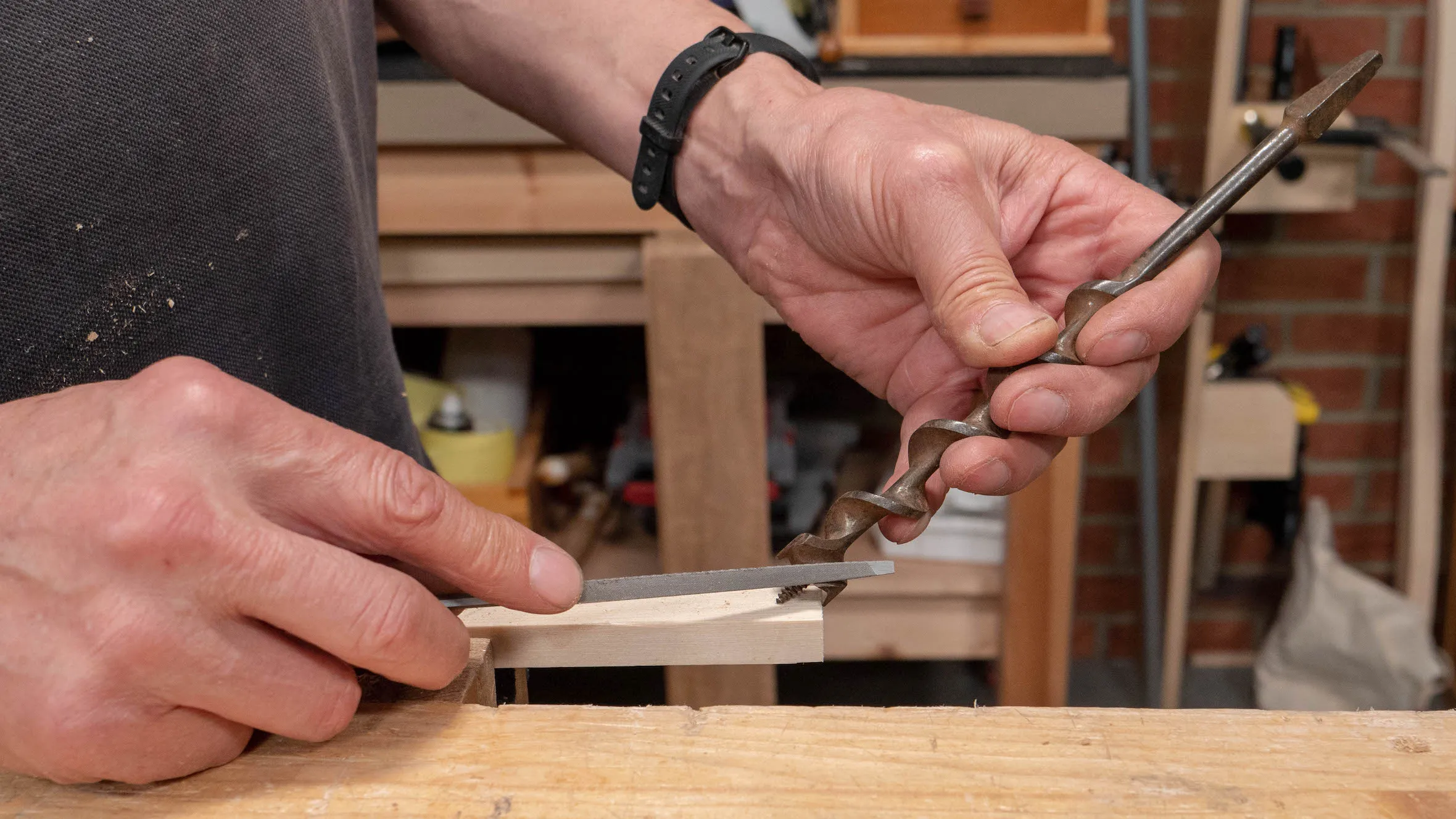 Hold the bit at an angle so you can use the saw file horizontally