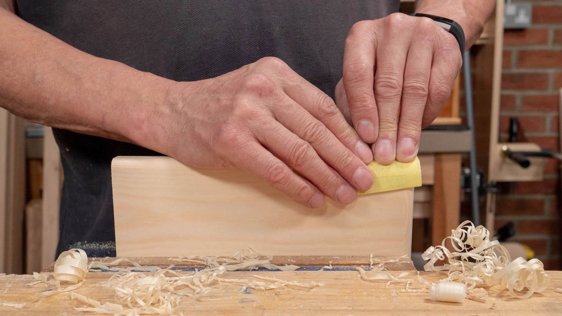 Use both hands when sanding
