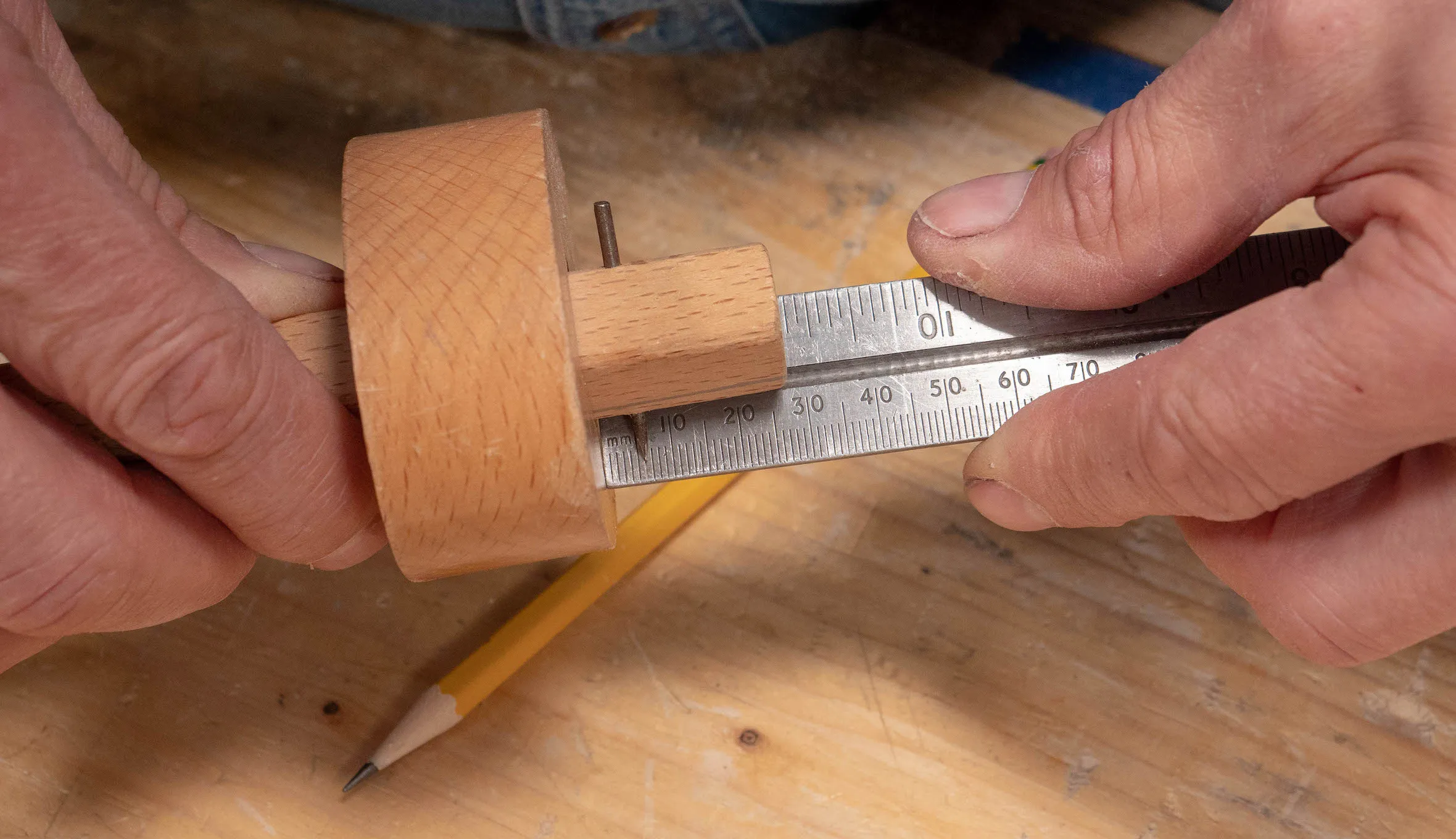 Set a single pin marking gauge to ¼” (6mm) and lock tight