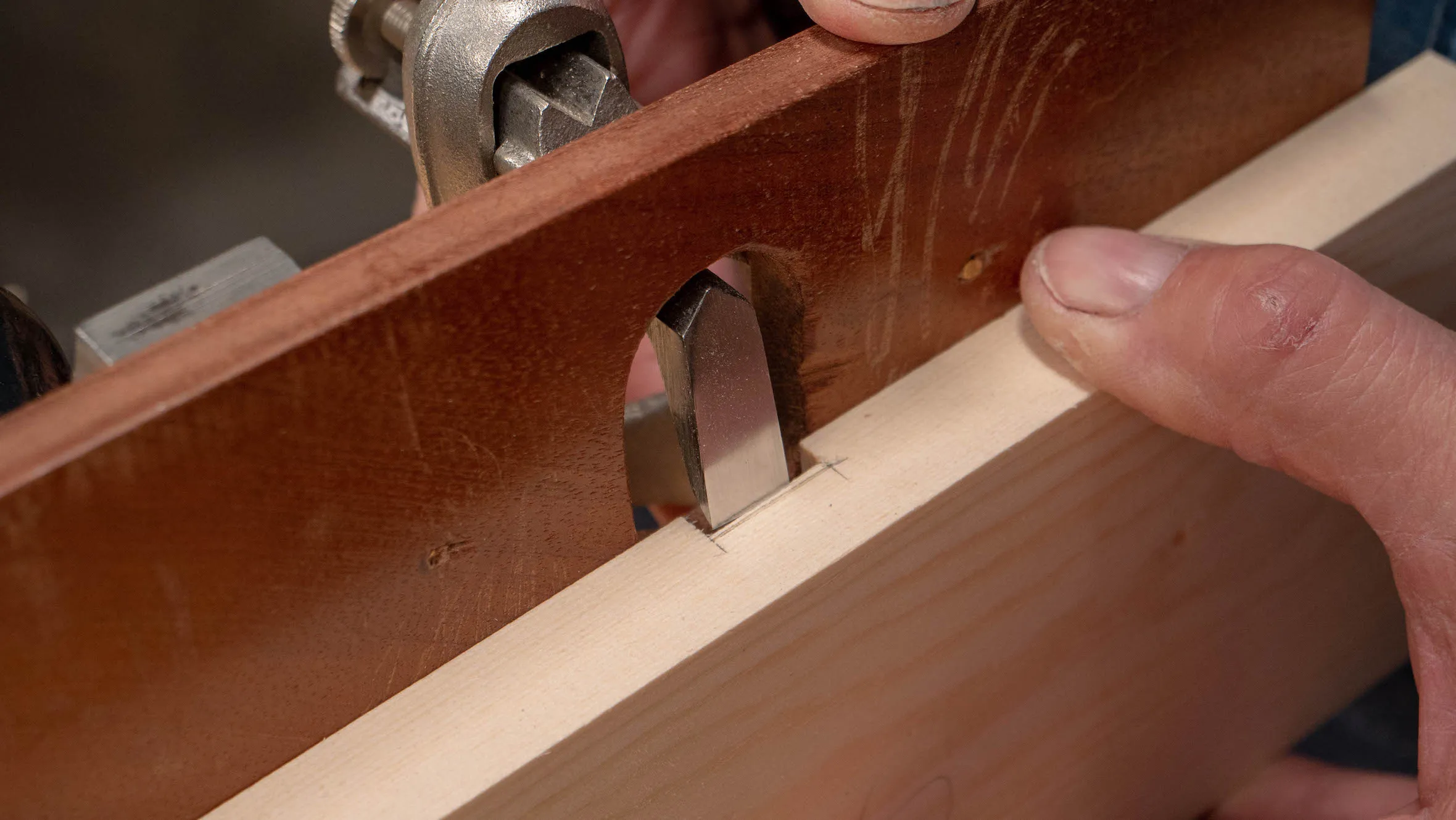 Initially, set the router cutter high above the gauge line