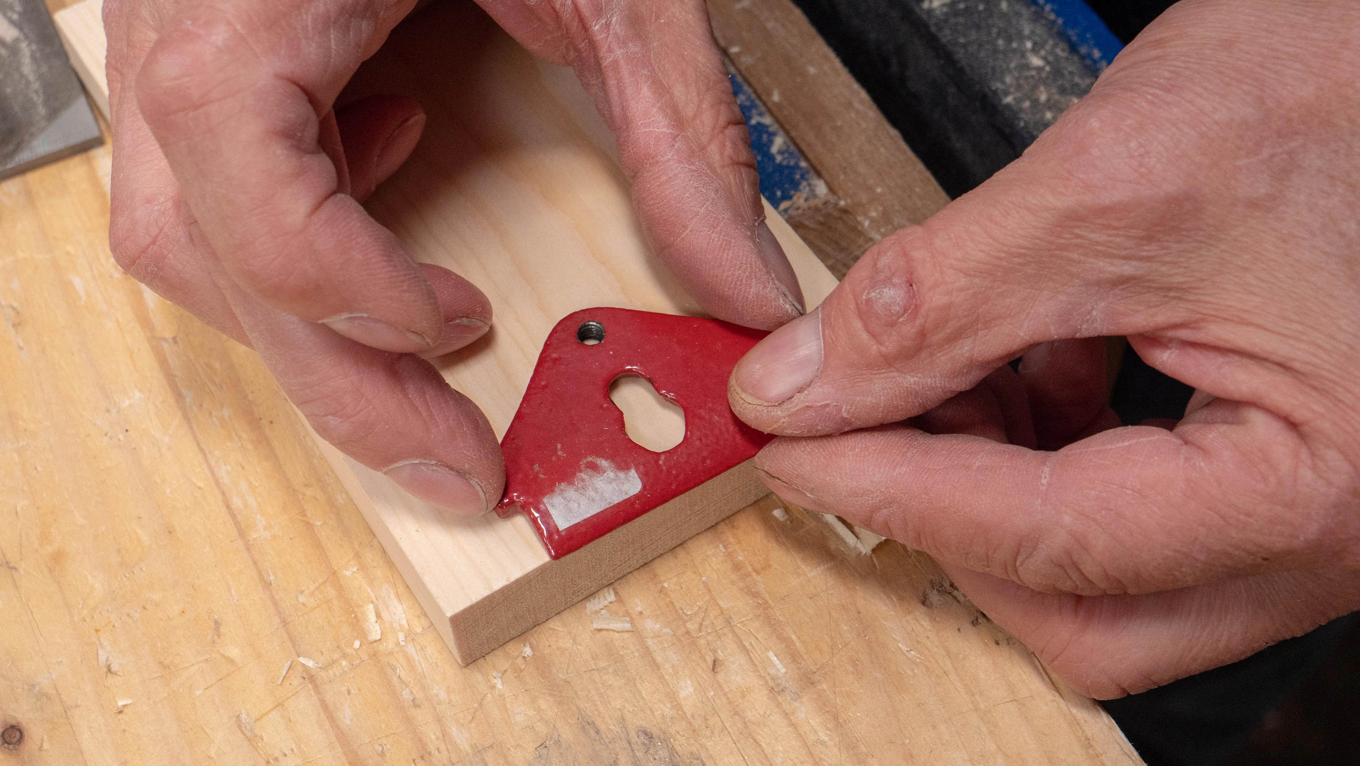Place the cap iron so it is slightly overhanging the edge of the wood