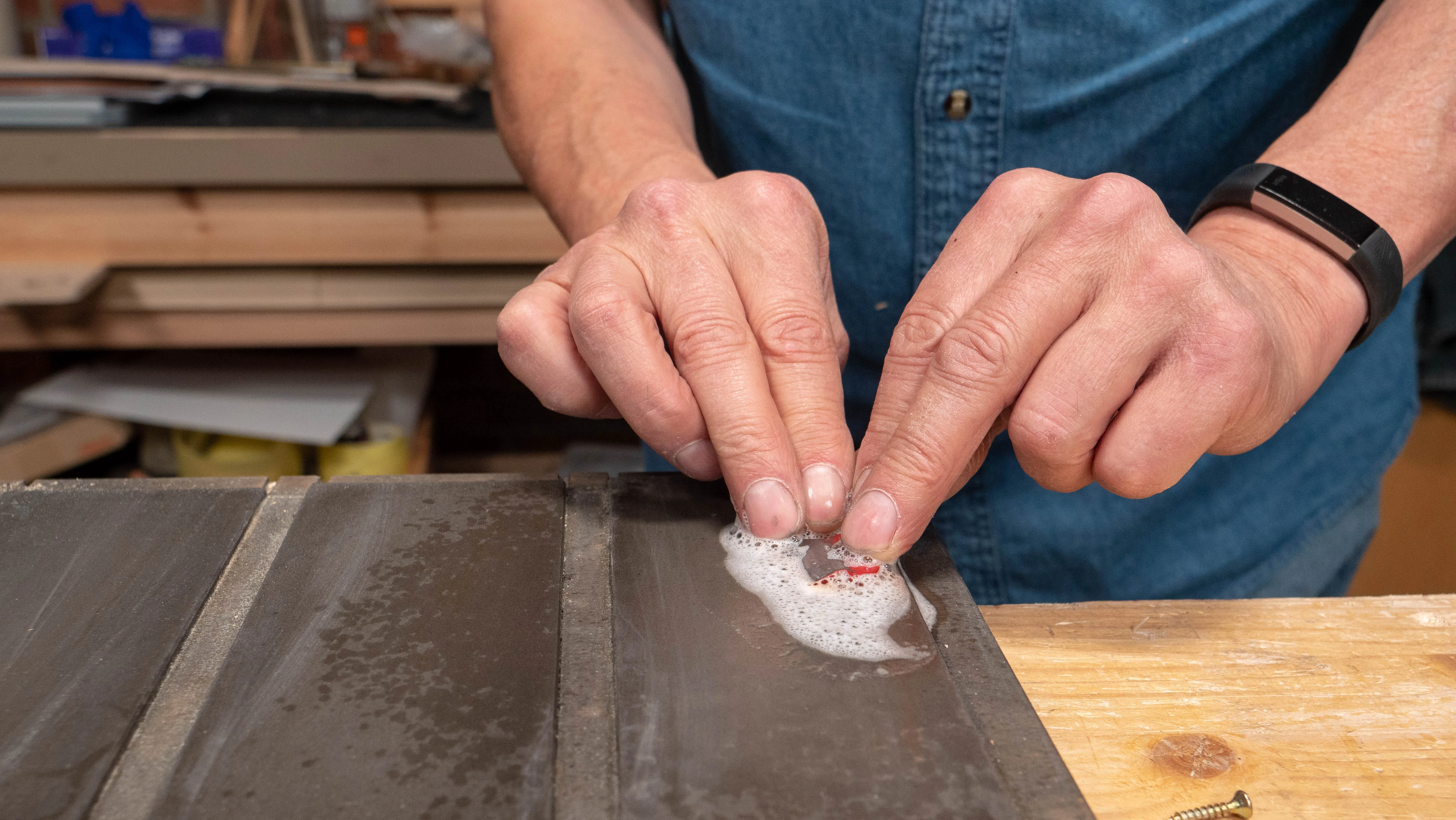 Remove from the wood holder and use the sharpening stones to even out the underside of the cap iron