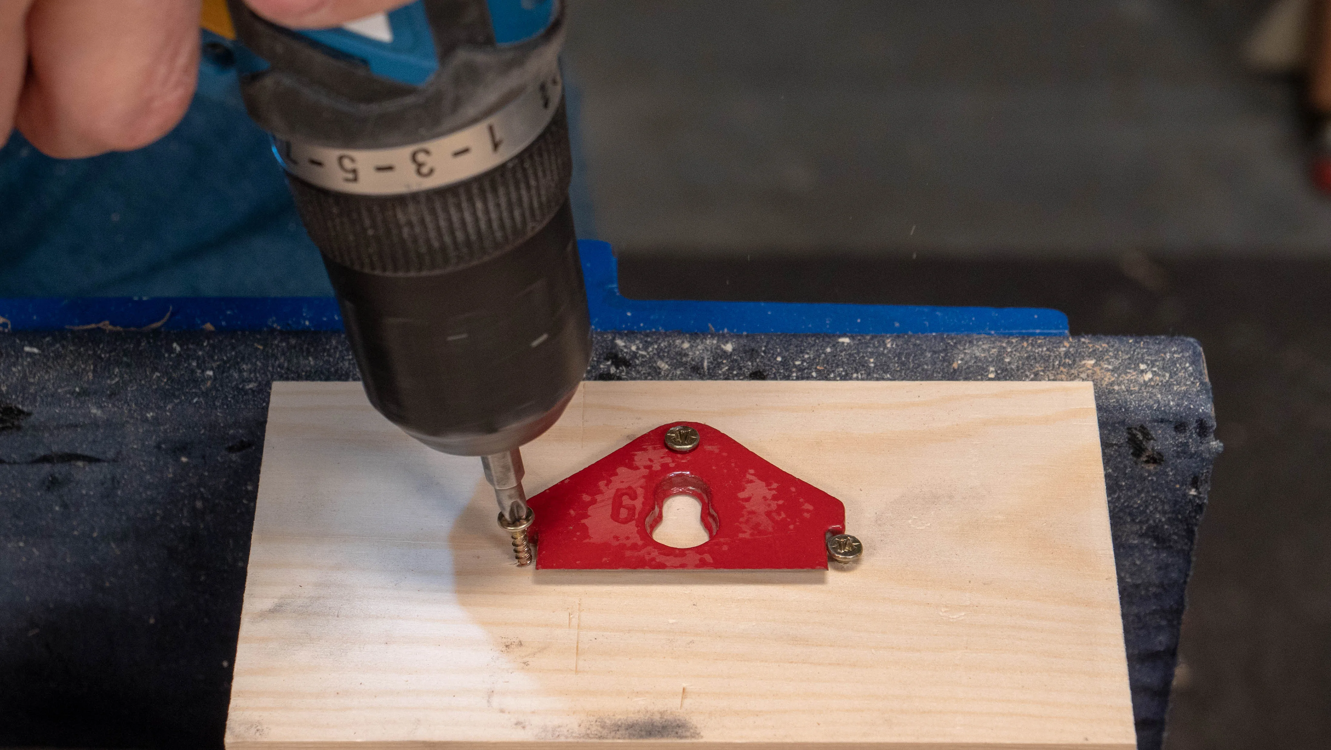 Screw back into the wood holder and use a file