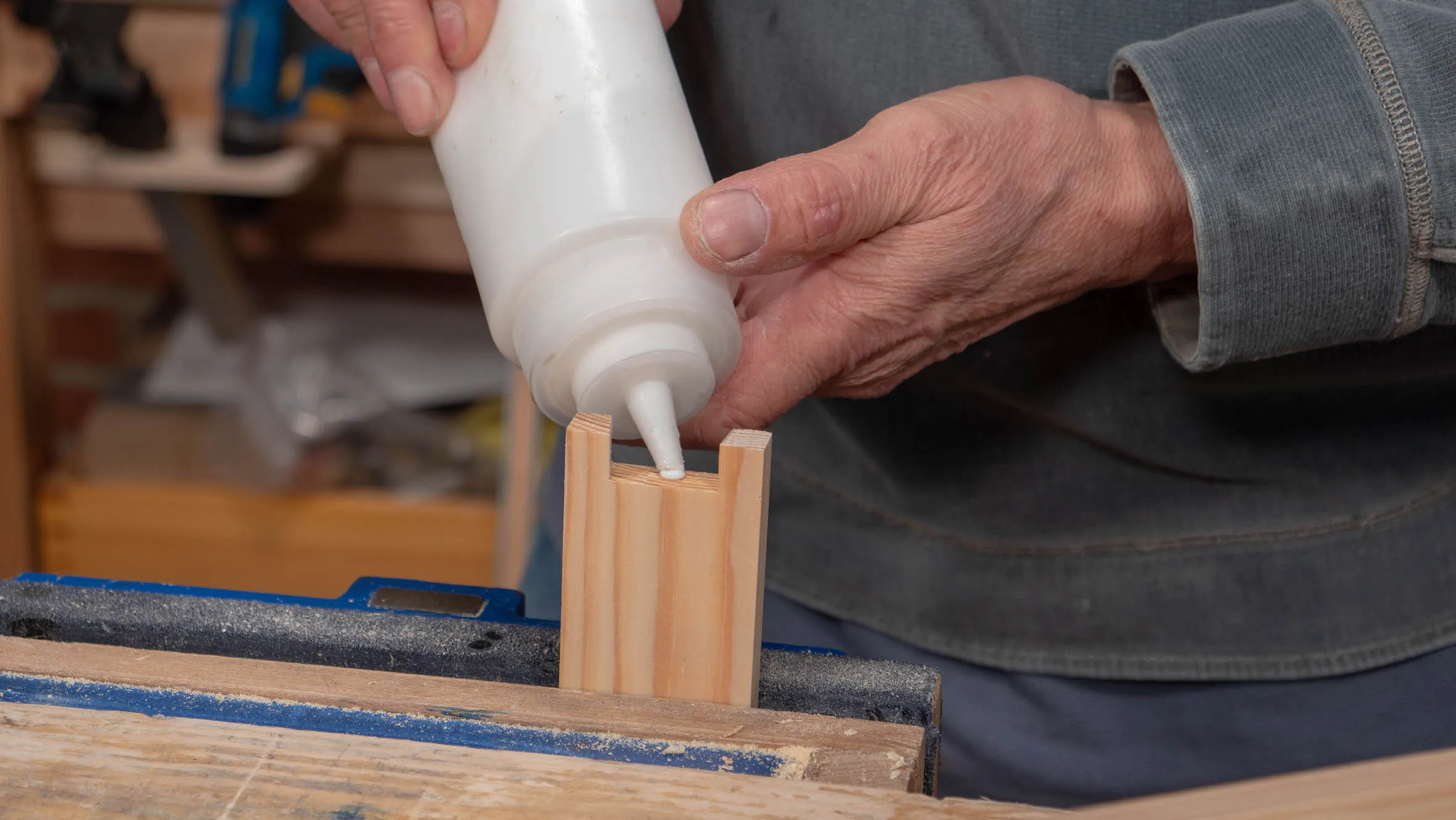 Apply a blob of glue on the tail recess between the pins