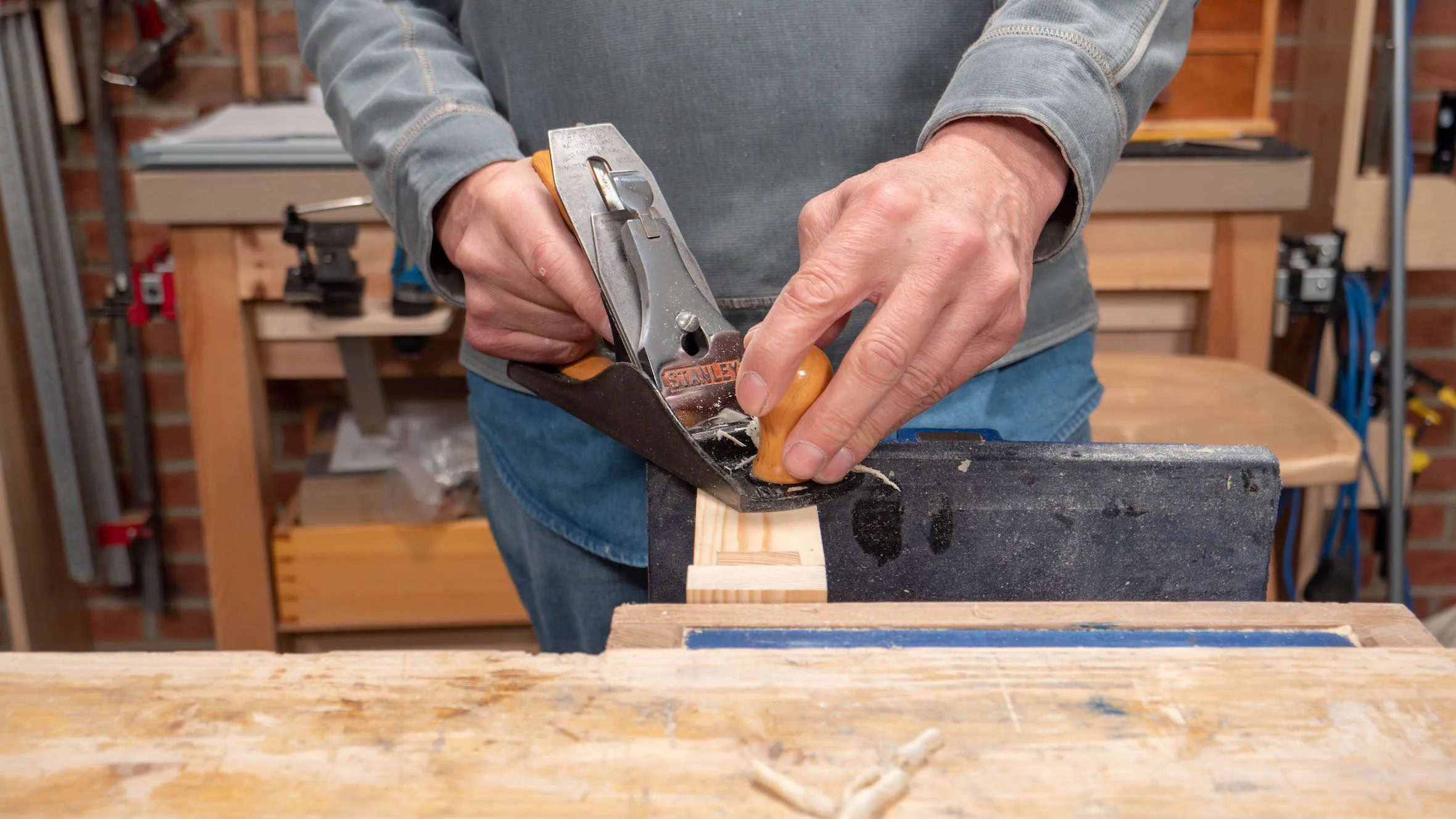 Clamp a scrap of wood onto the end of the short side