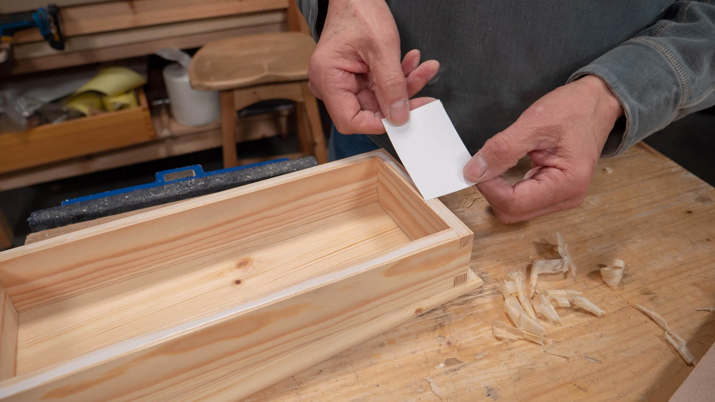 The edge of a piece of card-paper works well as a spreader