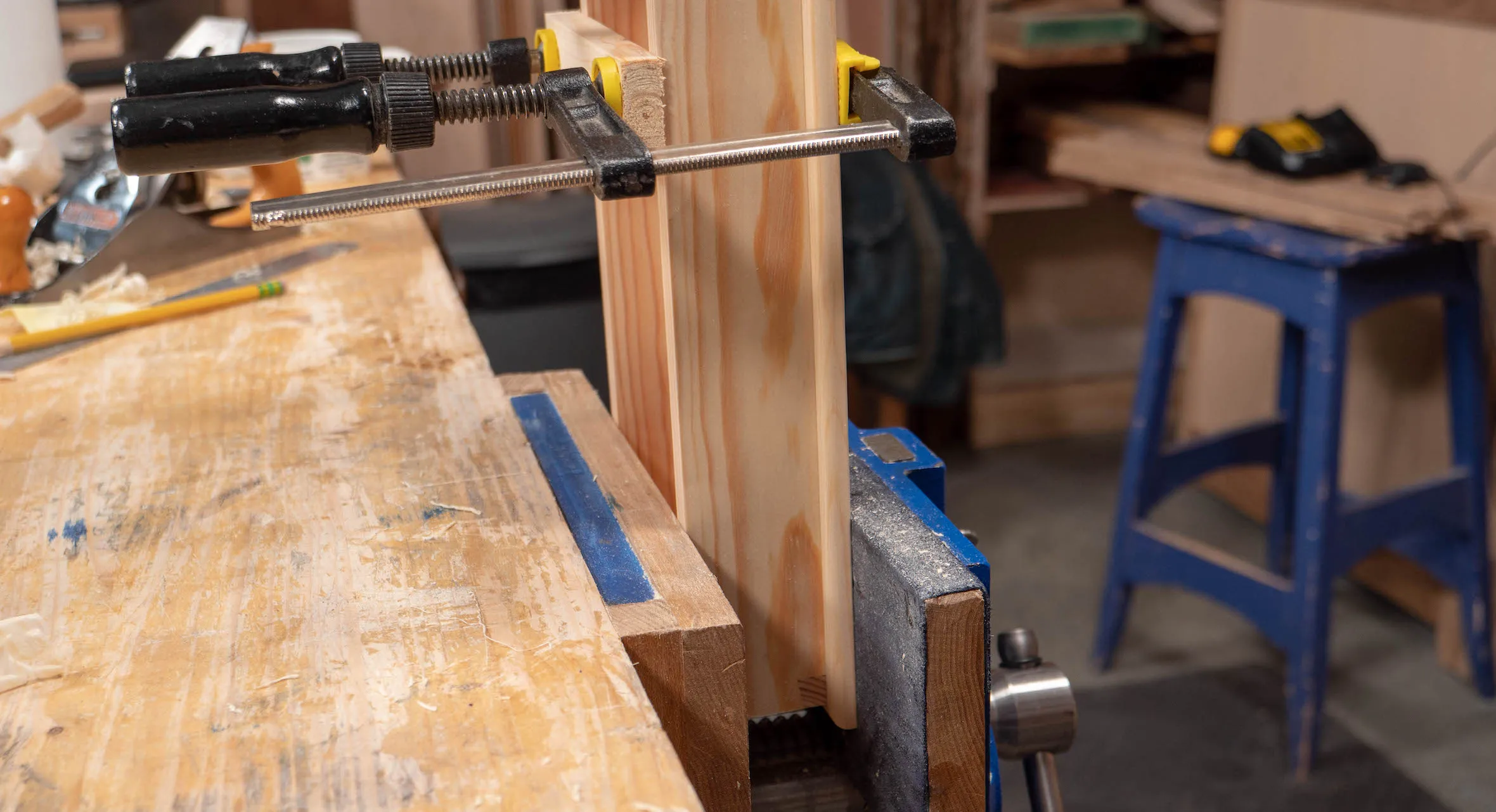 The vise will keep the parts together as you apply more clamps