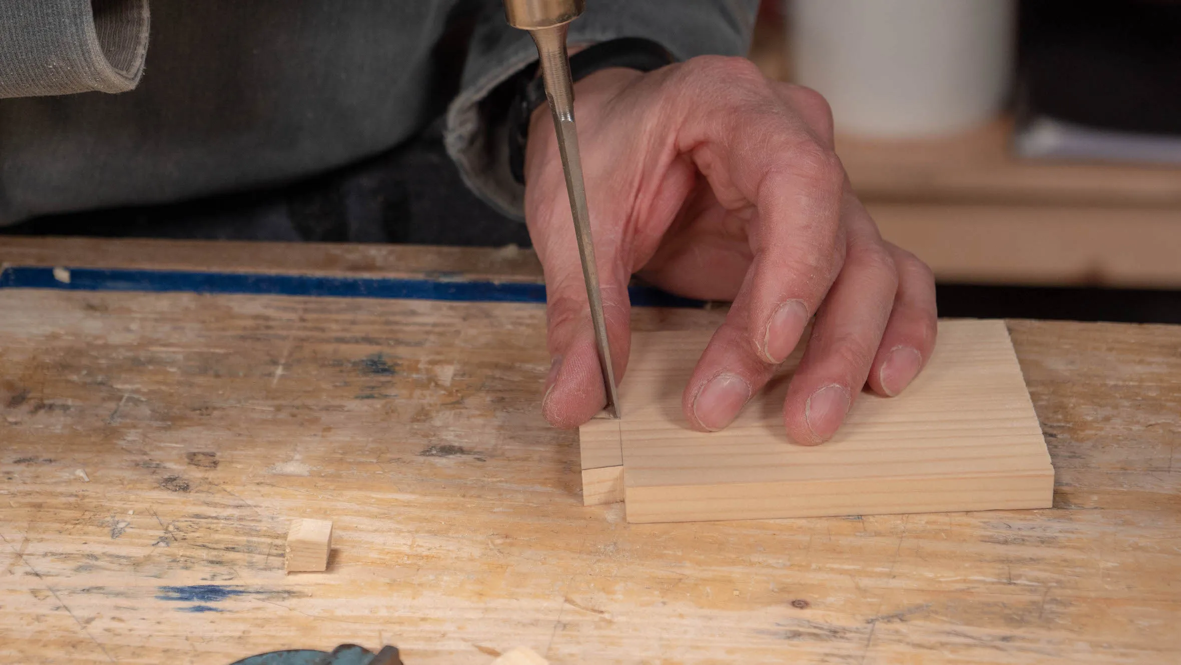 Take care to position the chisel accurately before you begin to chop the centre pin recess