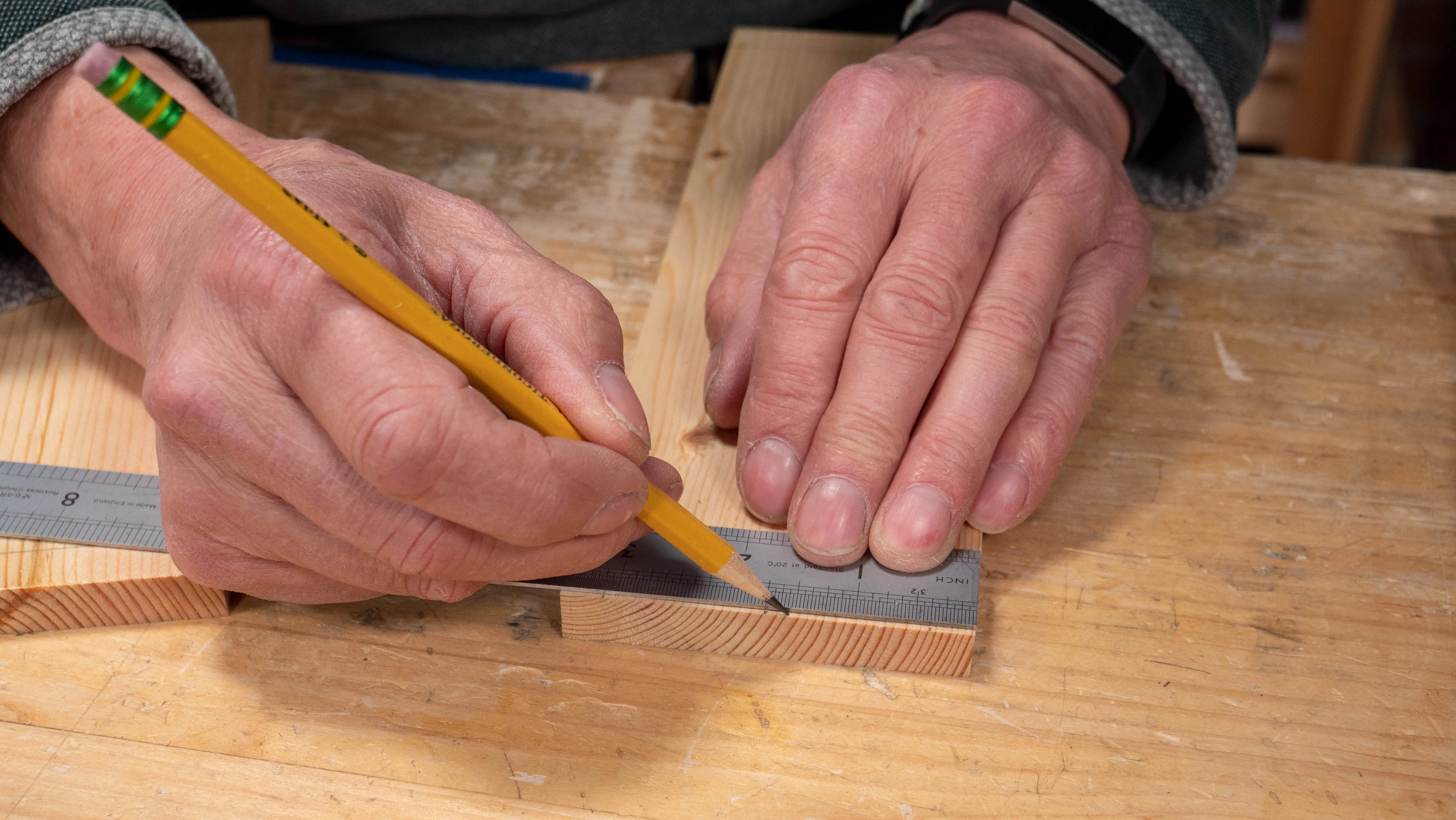 Mark 3/8" (10mm) from each end and 3/16" (5mm) to either side of the midpoint