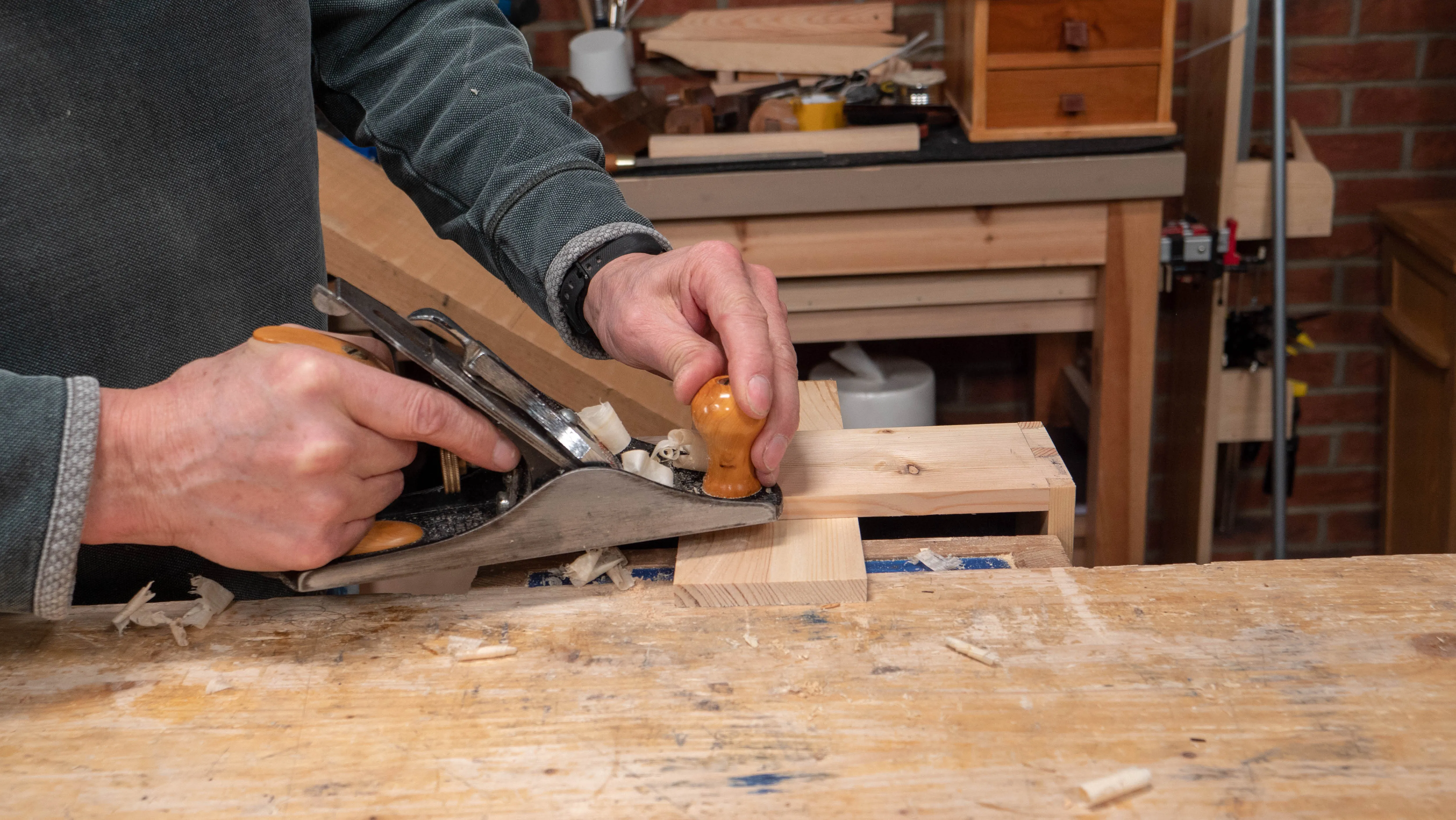 Work from both sides and lift the heel of the plane at the end of the cut