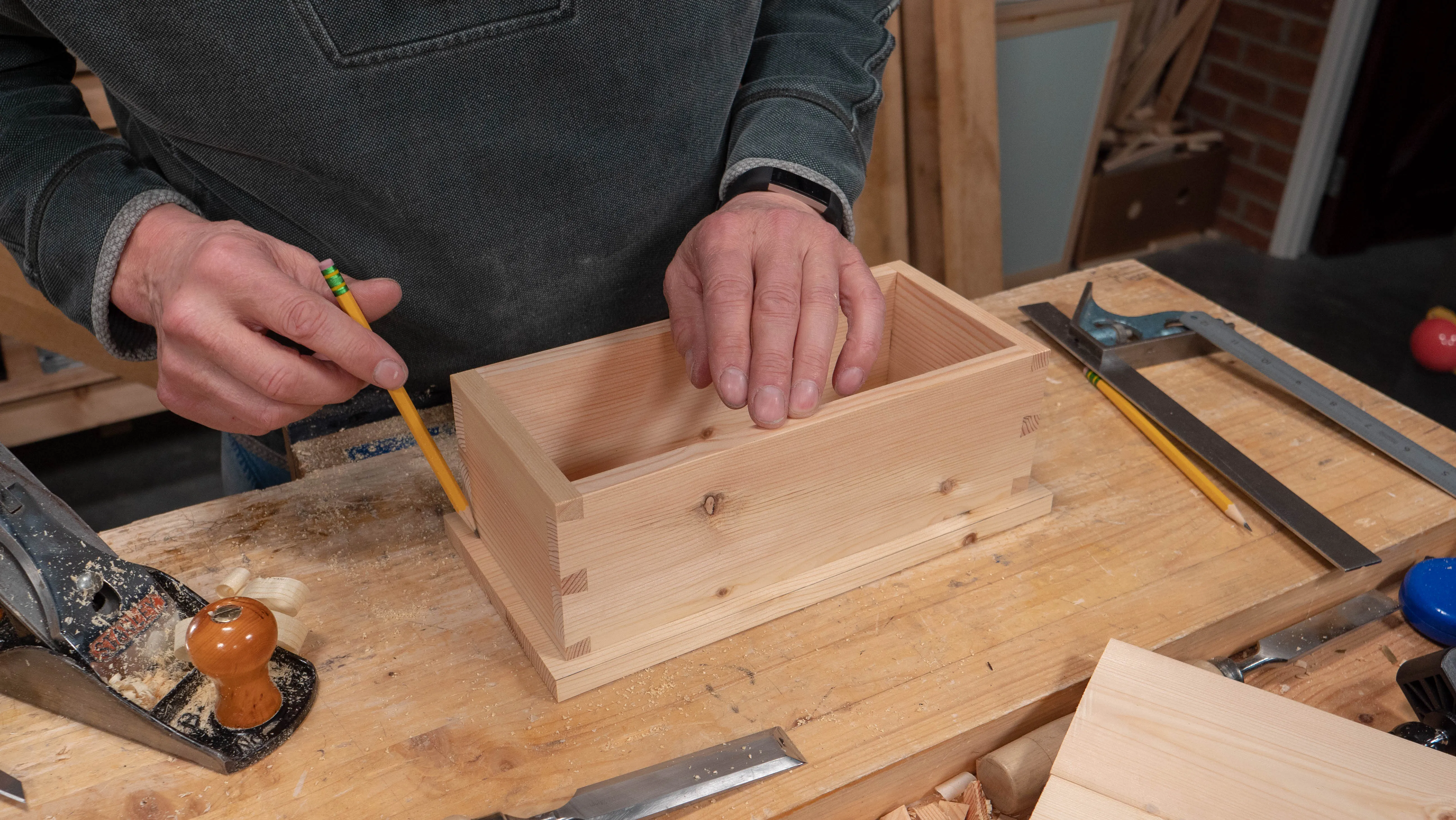 Mark around the box perimeter lightly with a pencil