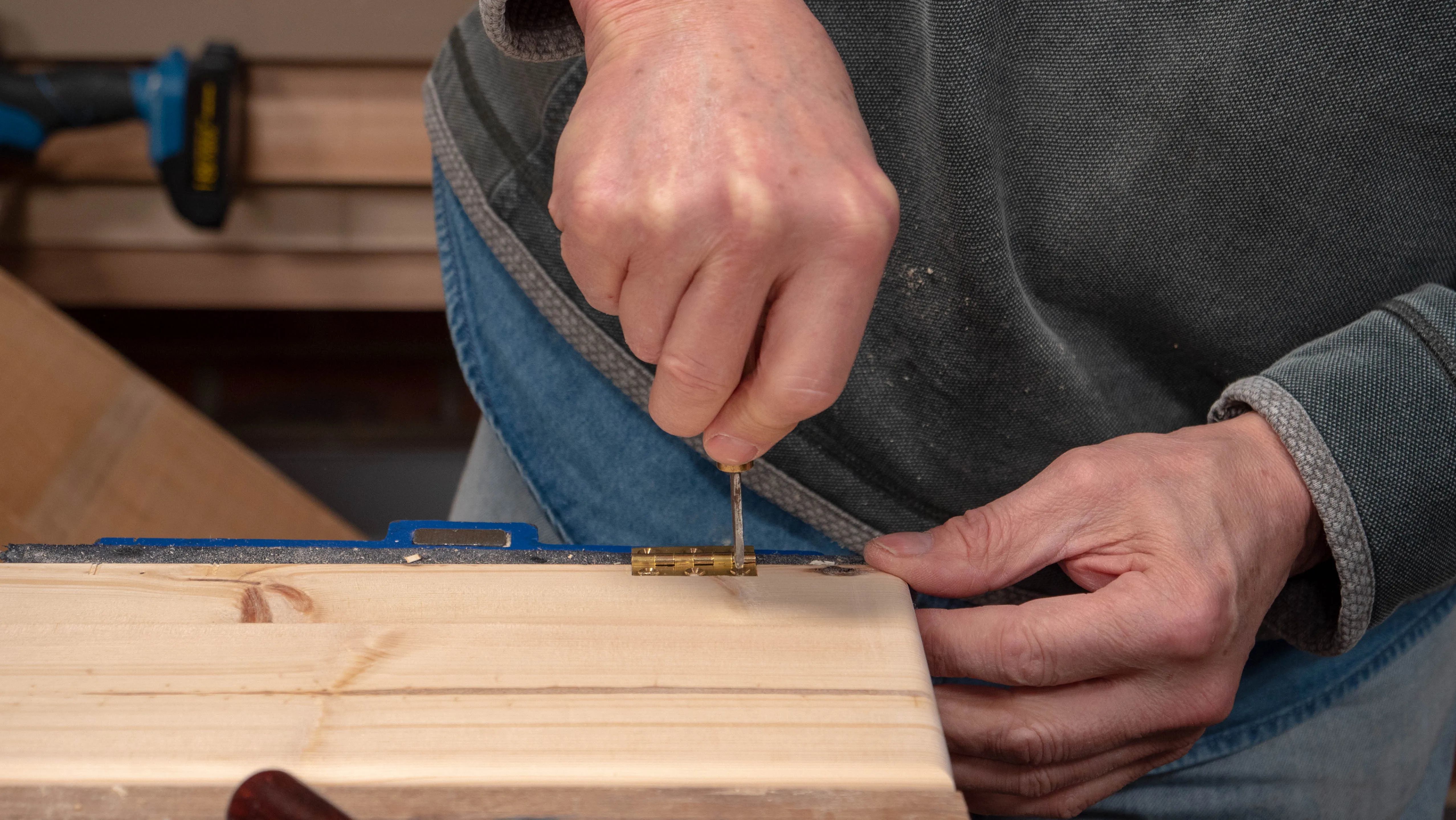 Use an awl to ream out conical holes for the screws