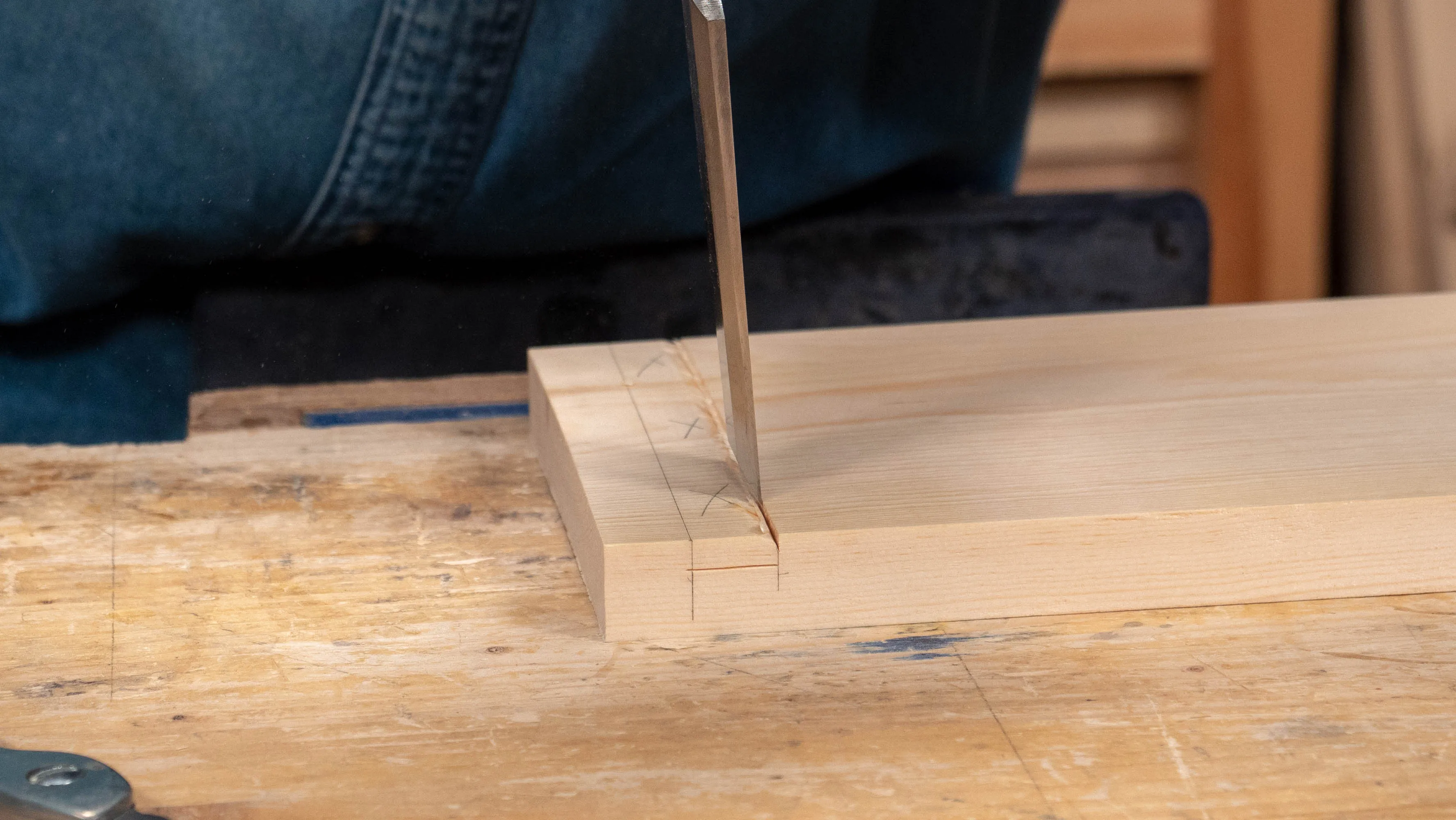 Start chopping vertically along the walls, taking care to keep the wall straight and avoid skewing your chisel (and catching the good wood)